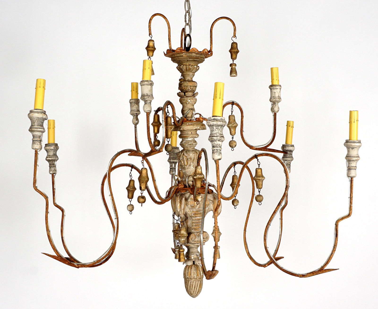Italian Provincial Nine Light Chandelier: Carved and turned grey painted wood baluster, scroll wrought iron arms, tassel and bell hanging decoration, wired at a later date, approx. 33" x 39" dia.