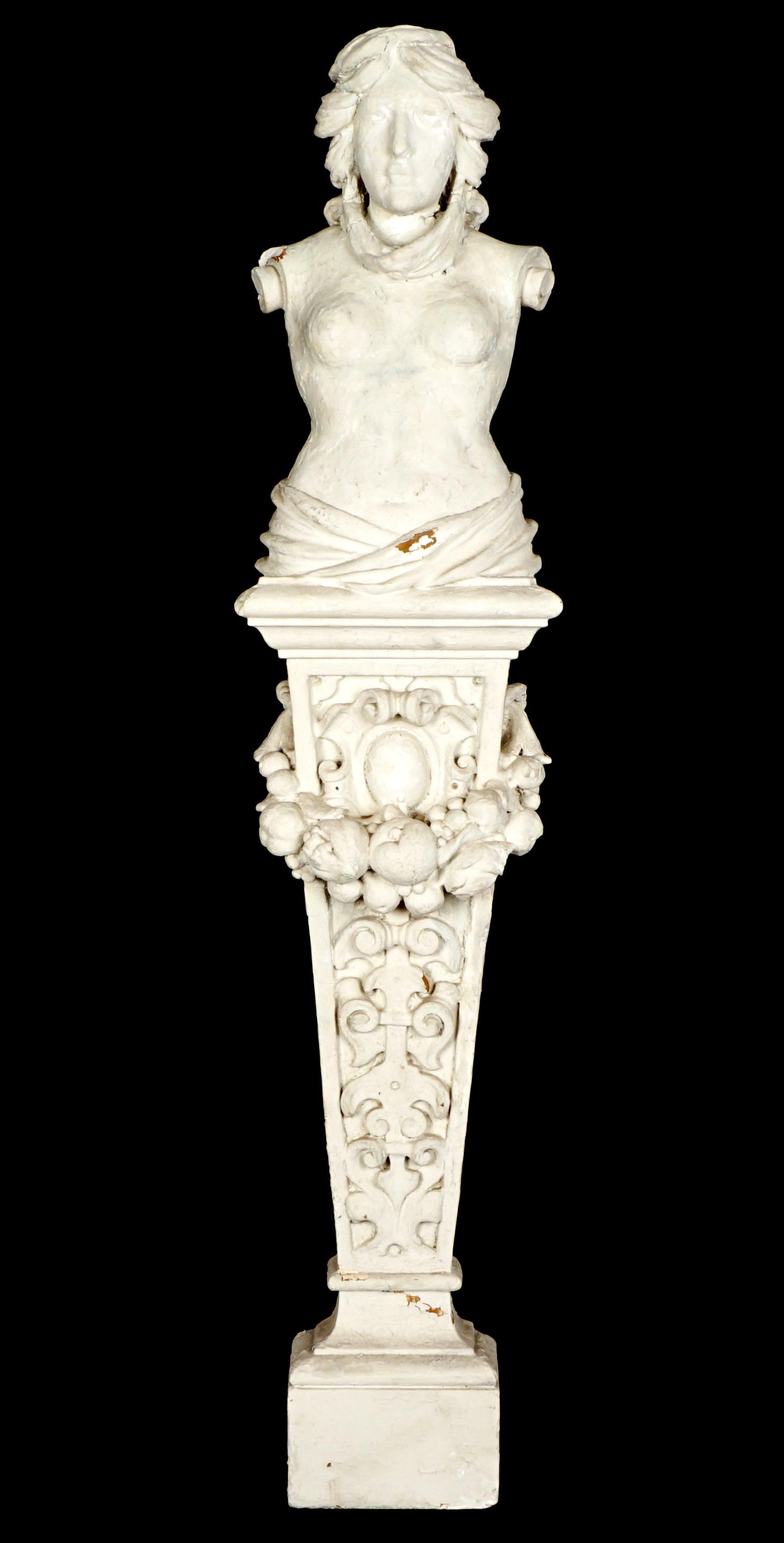 Plaster Figural Nude Woman Corbel: Pedestal for, semi-nude female bust over fruit and foliate scroll column, overall 49" h. x 10.5" x 6". Condition: Chips and loss.