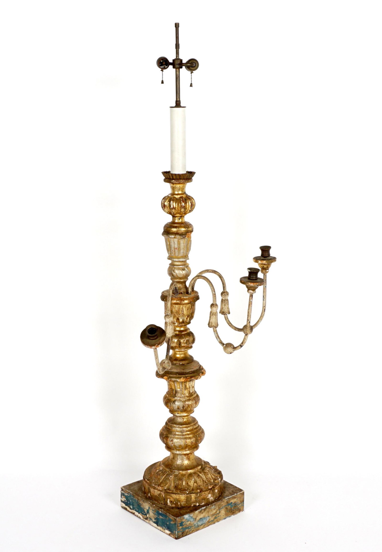 Large 18th C Carved Gilt wood Italian Pricket Lamp: 18th Century tall carved gilt wood pricket stick mounted as a lamp. Three scroll arms, top fitted with double socket fixture, overall 57" h .x 22" x 16". Condition: Chips, dings and loss of gilt, evid
