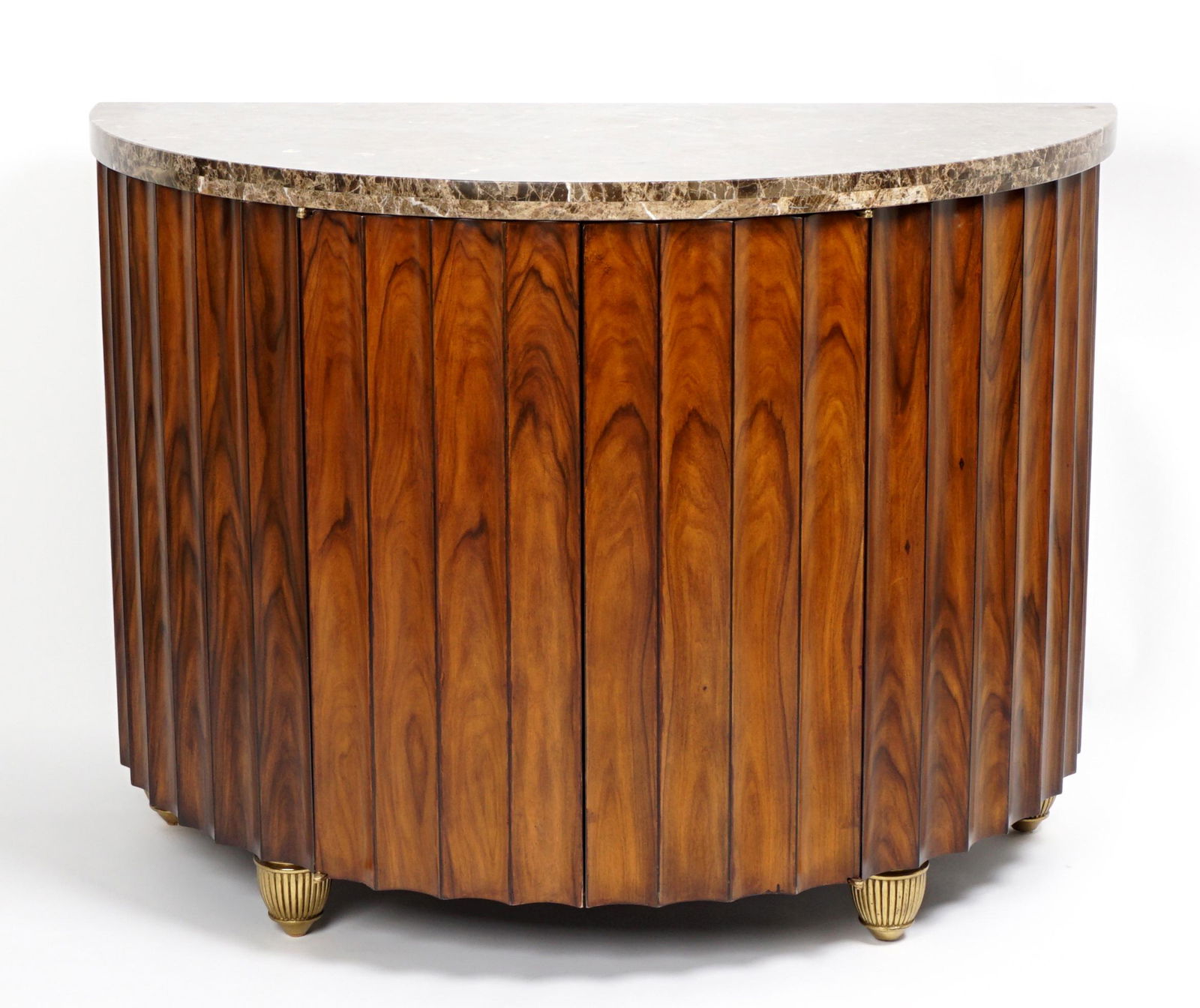 Maitland Smith Demi Lune Marble Top Cabinet: Variegated demi-lune marble top over two door fluted front wood case, single adjustable interior shelf, on brass feet. Maitland-Smith label verso. Overall 34.25" x 46.5" x 23.5".