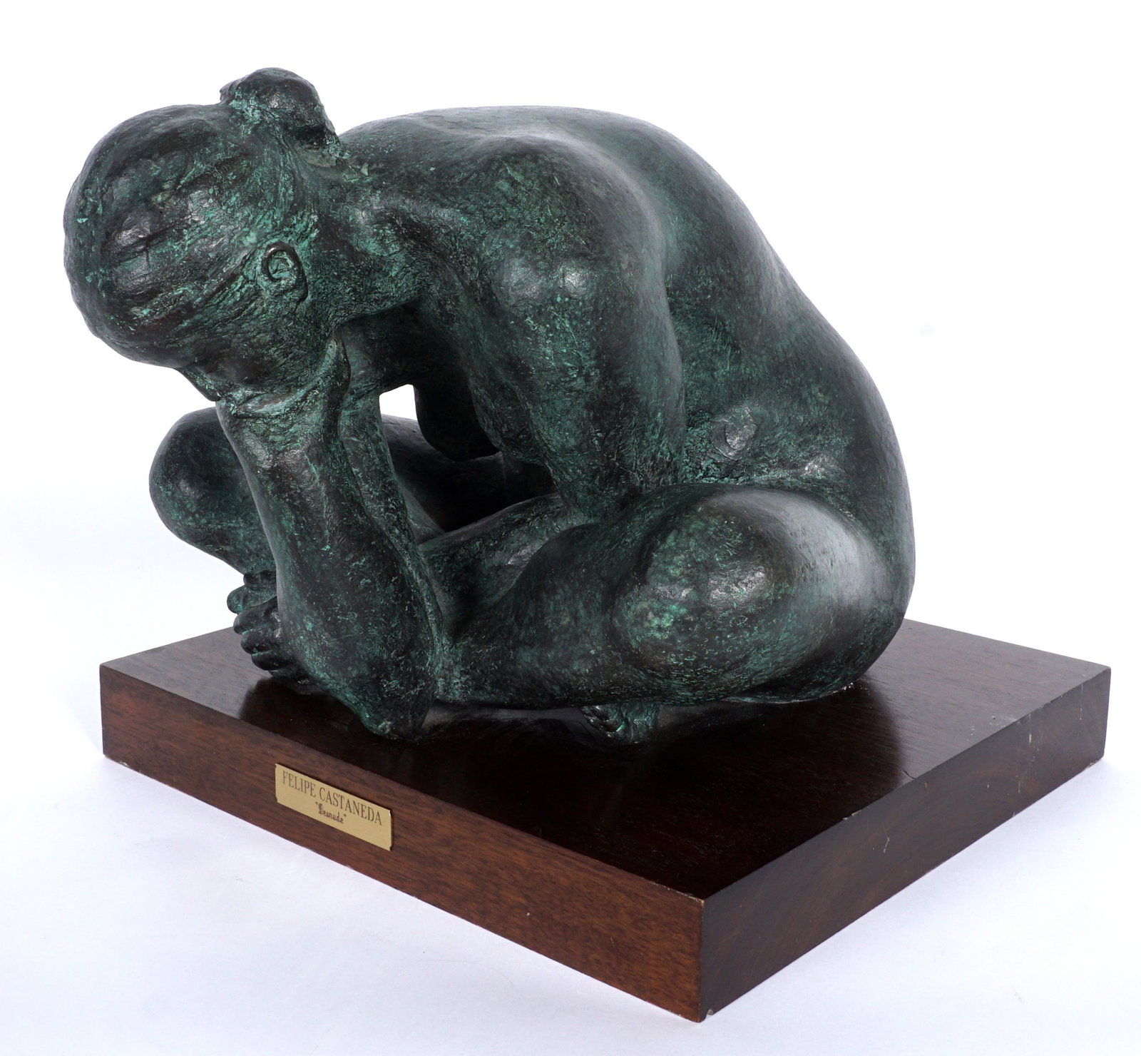 Felipe Castaneda "Desnude" Bronze Sculpture: CASTANEDA, Felipe, (Mexican, 1933-): Figure of a nude seated woman hunched over with head resting on one hand, titled "Desnude", Bronze, signed and dated 1980, affixed to wood plinth with plaque, over