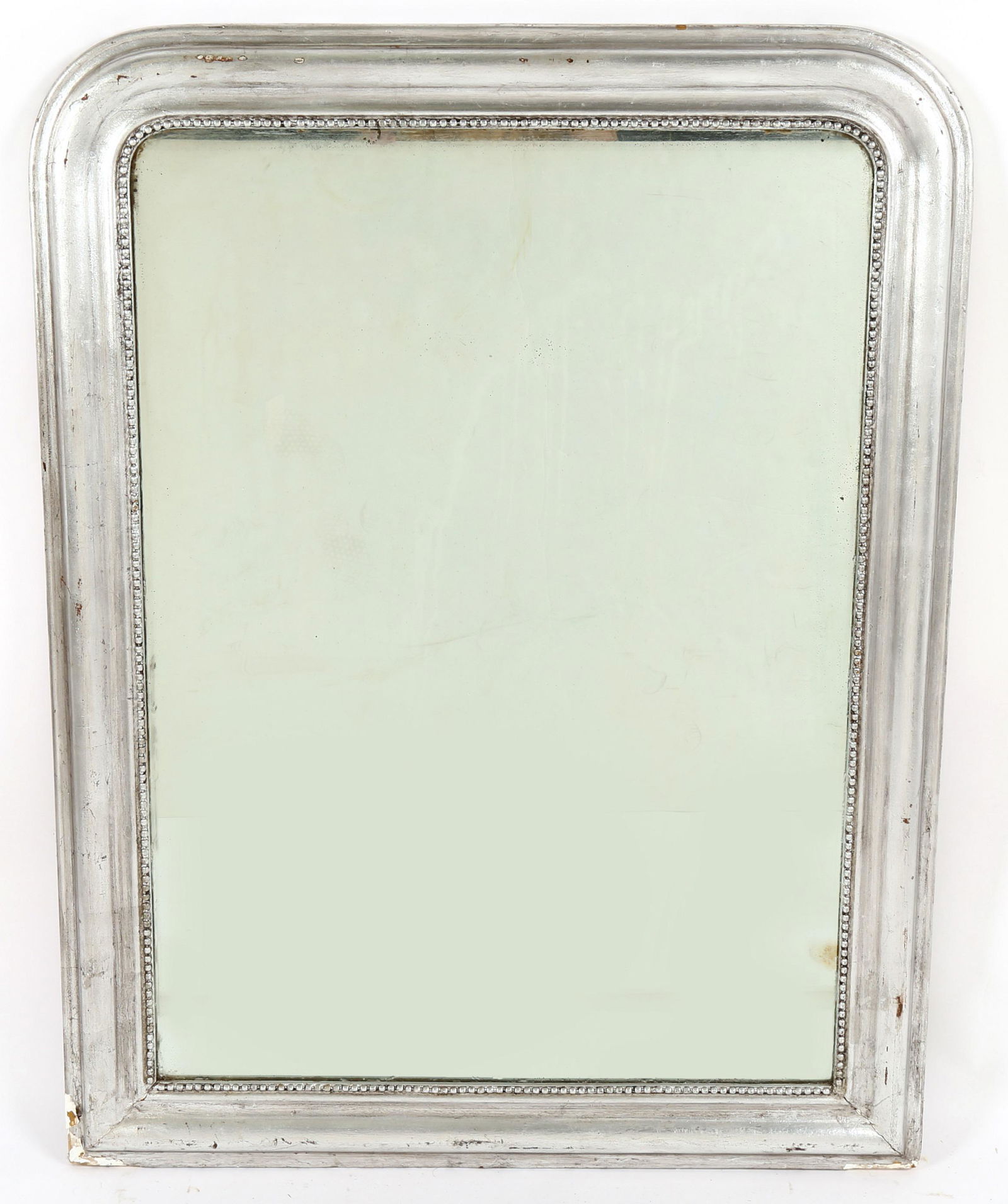 19th Century Louis Philippe Silver Gilt Mirror: Molded silver gilt wood frame with beaded trim, overall 46" h. x 35.5" x 1.5". Condition: Loss of gilt, spotting to mirror.