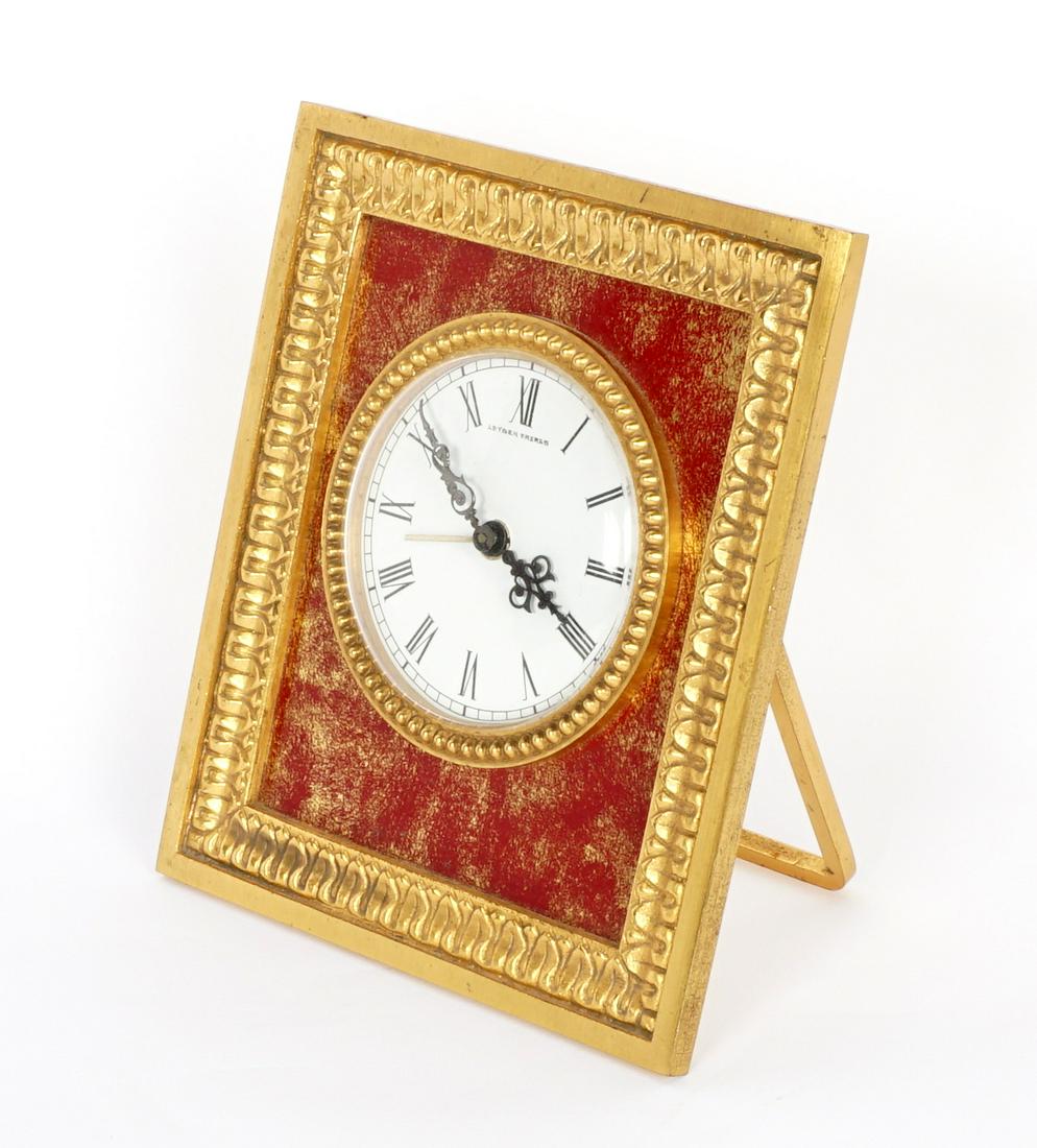 Leysen Freres Gilt Bronze Travel Alarm Clock: Gilt bronze and enamel easel back frame travel alarm clock, porcelain dial well marked Leysen Freres. Measures 5.5" x 4.75". Currently running however not guaranteed to continue or keep accurate time.