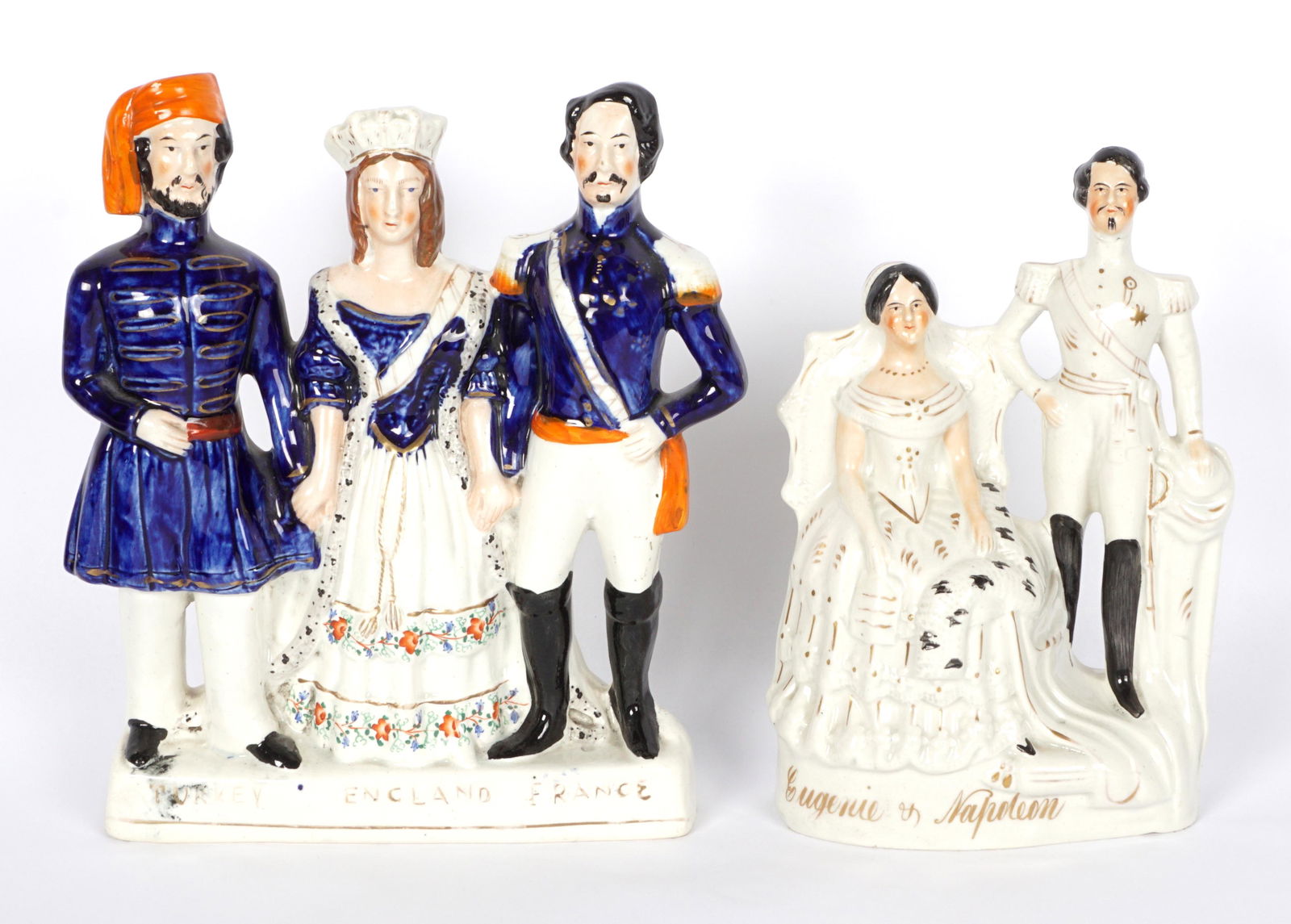 Two Staffordshire Historical Figural Groups: Two pieces total to include 1) Figures of Eugenie & Napoleon, 9.5" h. x 6.5" x 3.25". 2) "Turkey, England, France", three standing figures, 10.5" h. x 9.5" x 3". Hairline crack to base. Condition: Bot