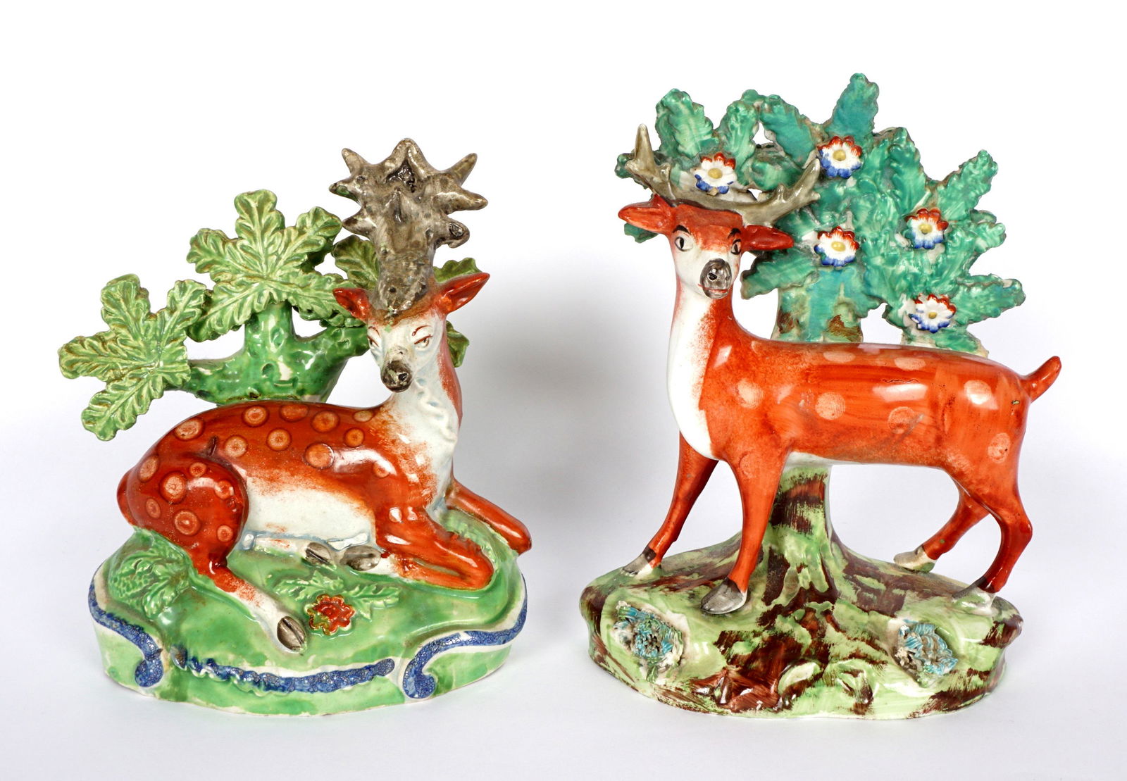 Pair Staffordshire Stag Deer Figures: Rare and early Staffordshire figures, on deer standing, the other in repose, taller measures 6" h. x 4.5" x 2.5".