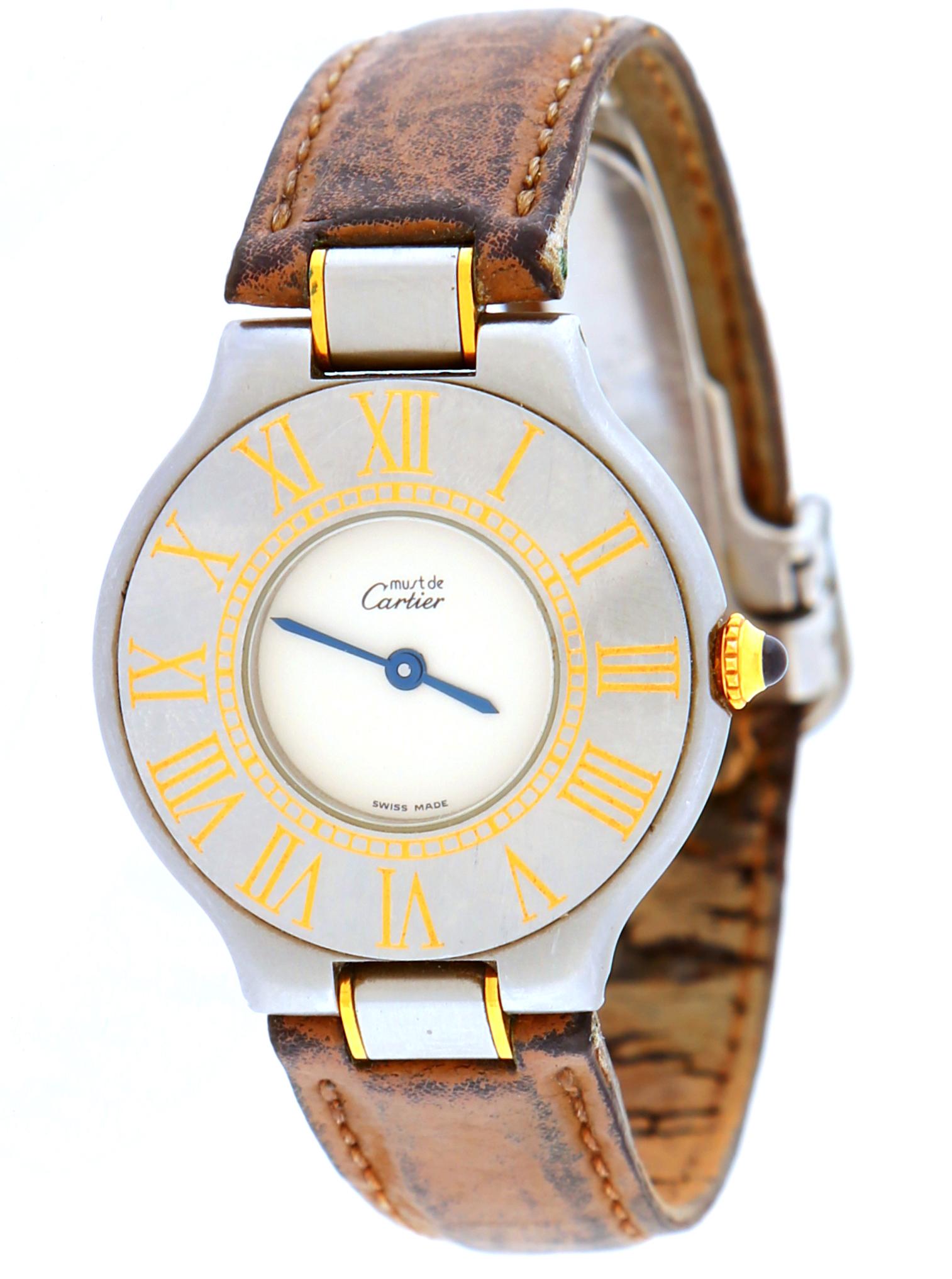 Must de Cartier Men's Watch: Stainless steel and gold tone case, marked on dial Must de Cartier, leather band, stainless steel clasp. Condition: Corrosion to back, scratches to dial, band extremely worn. Currently no running.