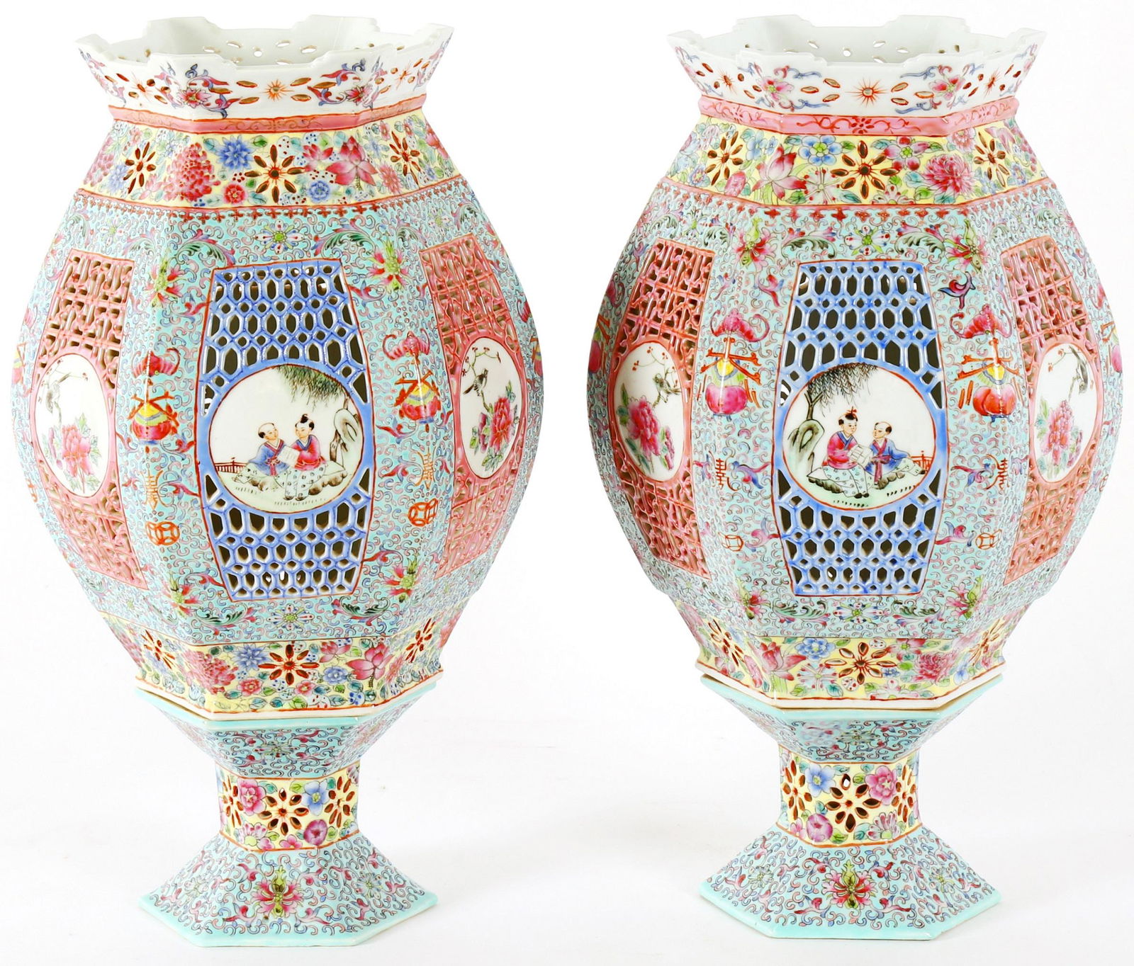 Pair Chinese Famille Rose Porcelain Lanterns: Reticulated bulbous hexagonal lamp on bases, pastel rose medallion decoration, 20th Century, overall 15.5" h. x 9".