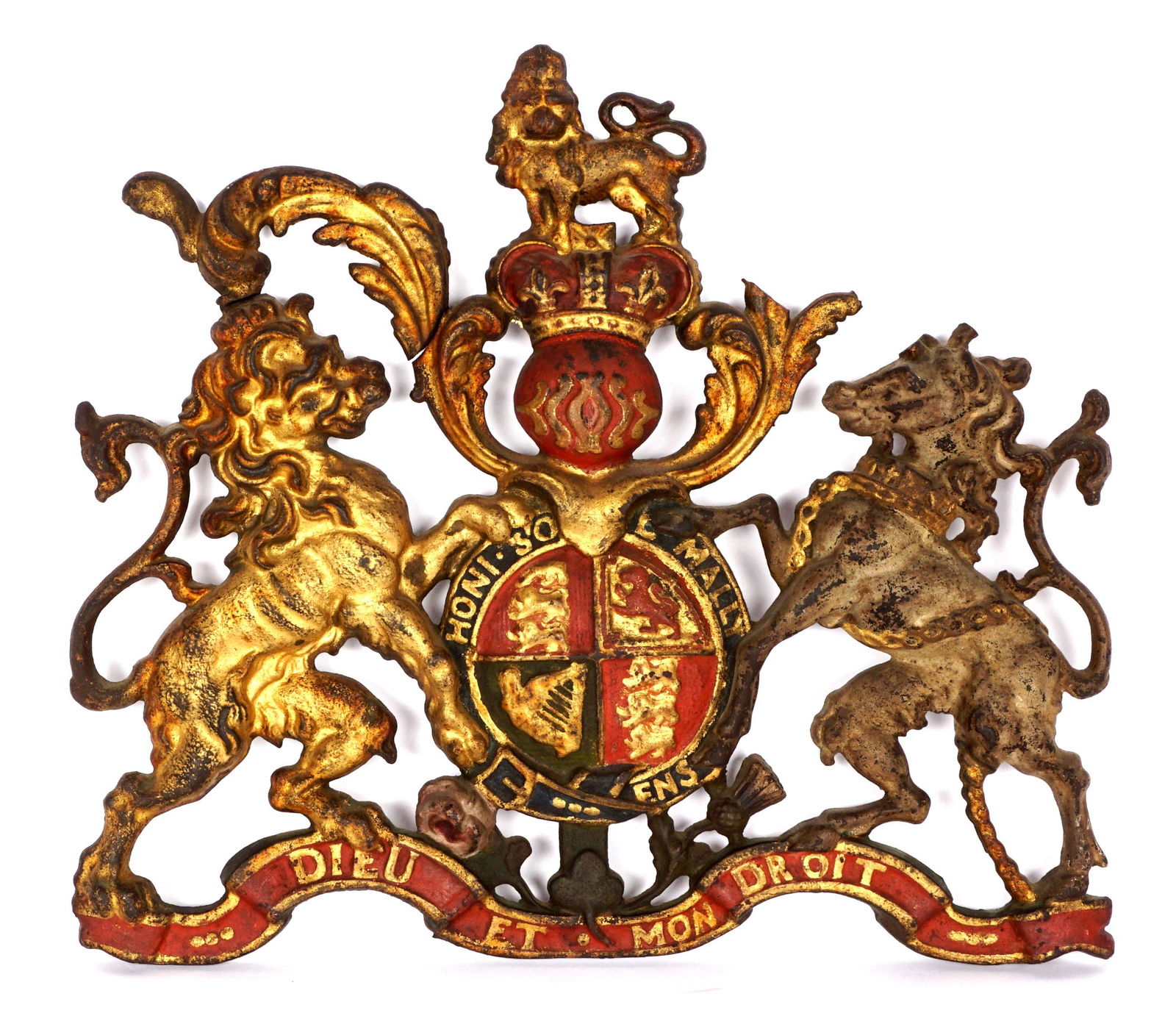 Heavy Cast Iron England Coat of Arm Wall Plaque: Painted cast iron coat of arms for the United Kingdom, rampant lion and unicorn, overall measures 17" h. x 19.5" x 1". Condition: Loss of foliate section upper right, repair to same section upper left