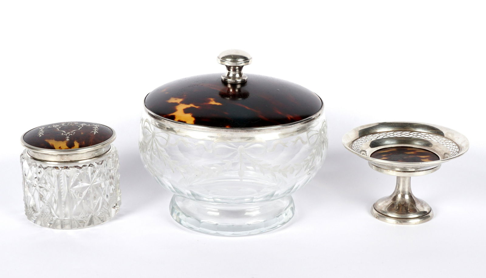 Three Cut Glass & Tortoise Shell Objets de Vertu: An assembled pieces of three pieces total to include 1) Charles & Richard Comyns, London, round covered box, tortoise shell and sterling lid etched ribbon garland body, cut foot, 5.5" h. x 6". 2) Char