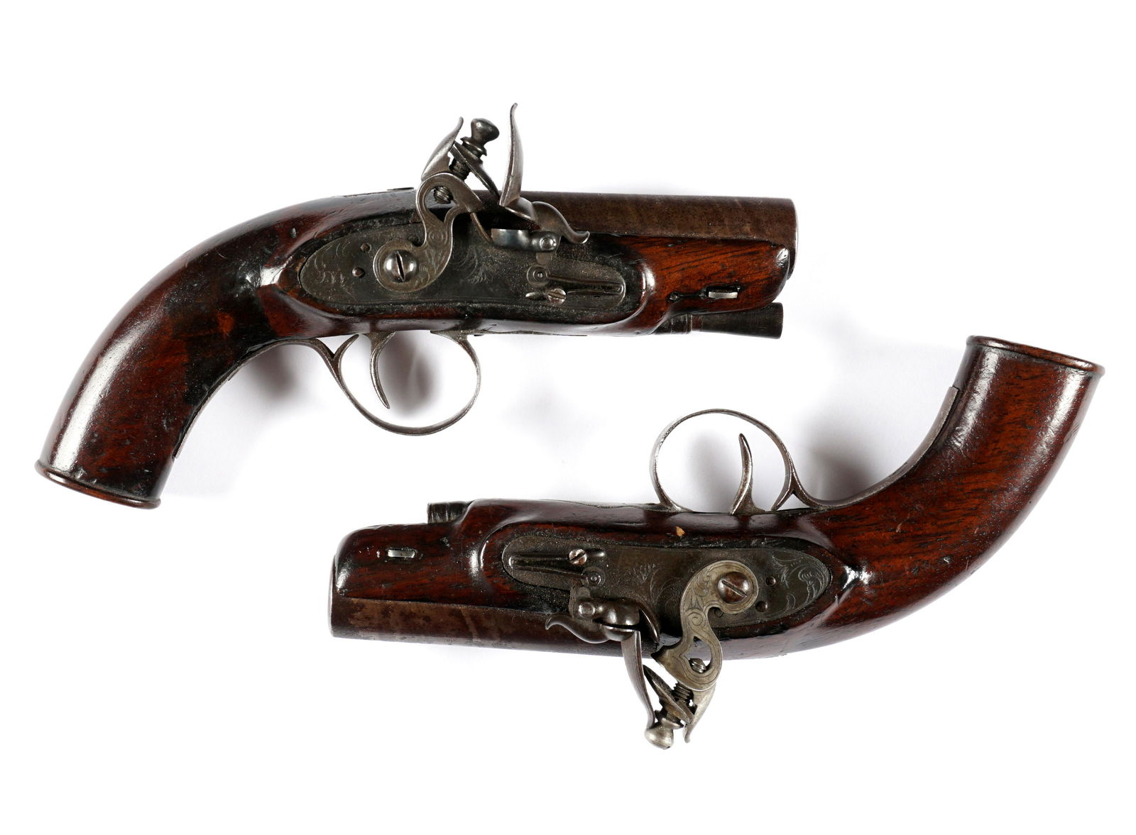 Pair Matched Richardson Irish Flintlock Pistols: Lovely matched pair of small flintlock pistols marked Richardson Limerick on the approx. .50 caliber 3" smooth bore barrel. Engraved lockplate and trigger guard, walnut stocks. Overall 7" long. Condit