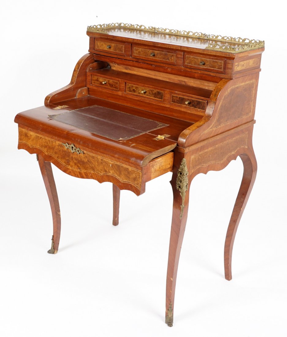 French Mechanical Bonheur Du Jour Desk: 20th Century, bronze gallery over three drawers, cylinder roll front opens when lower drawer pulled out, fitted interior with three drawers and inset embossed writing surface, all on cabriole legs, ca