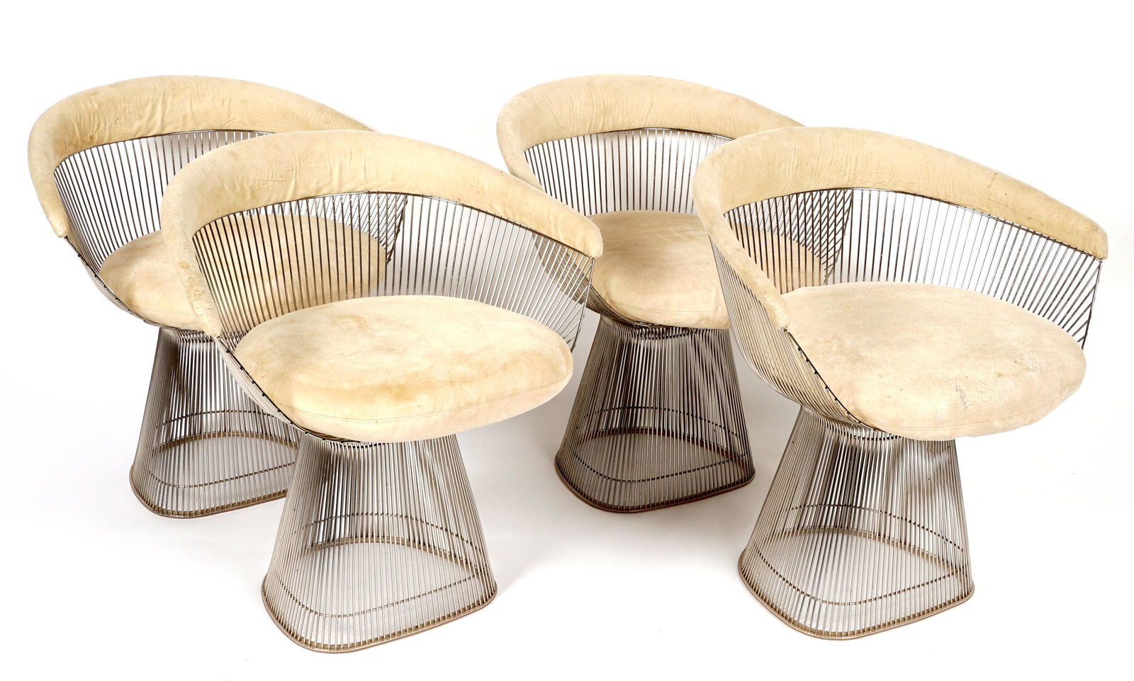 Four Warren Platner for Knoll Side Wire Chairs: Designed by Warren Platner for Knoll, chrome plated steel wire frame, cream upholstered top rail and cushion, marked Knoll under cushion, overall 29.5" h. x 28" x 23". Condition: Wear to upholstery.