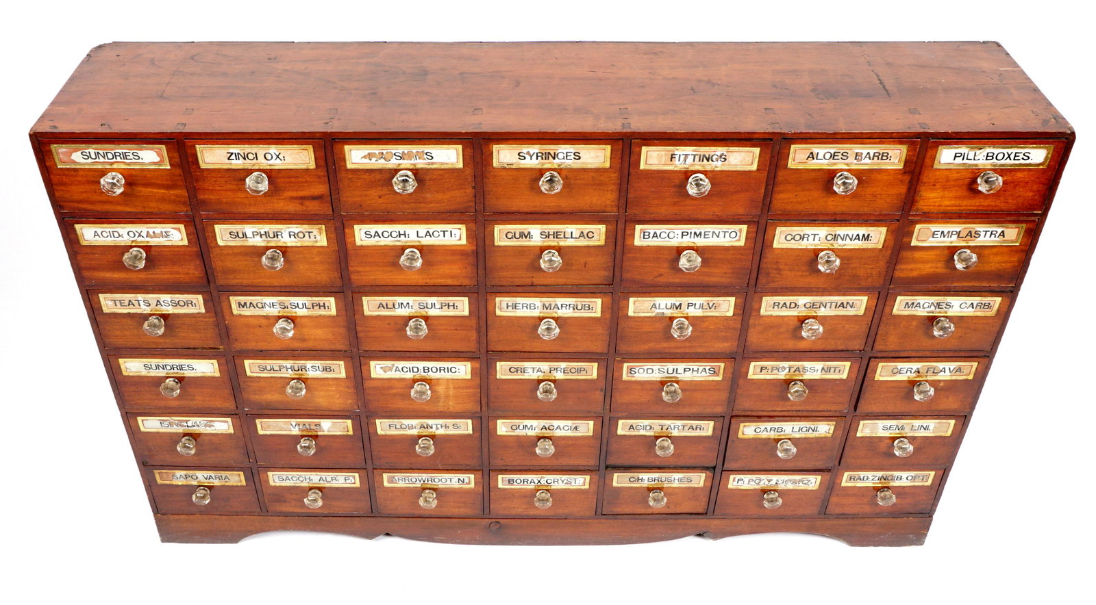 Late 19th C. Large 42 Drawer Apothecary Cabinet: 42 drawers, each with reverse painted glass labels, glass pulls, overall measures 37" h. x 58.5" x 12". Condition: Loss of paint to multiple plaques, other wear consistent with age and use.