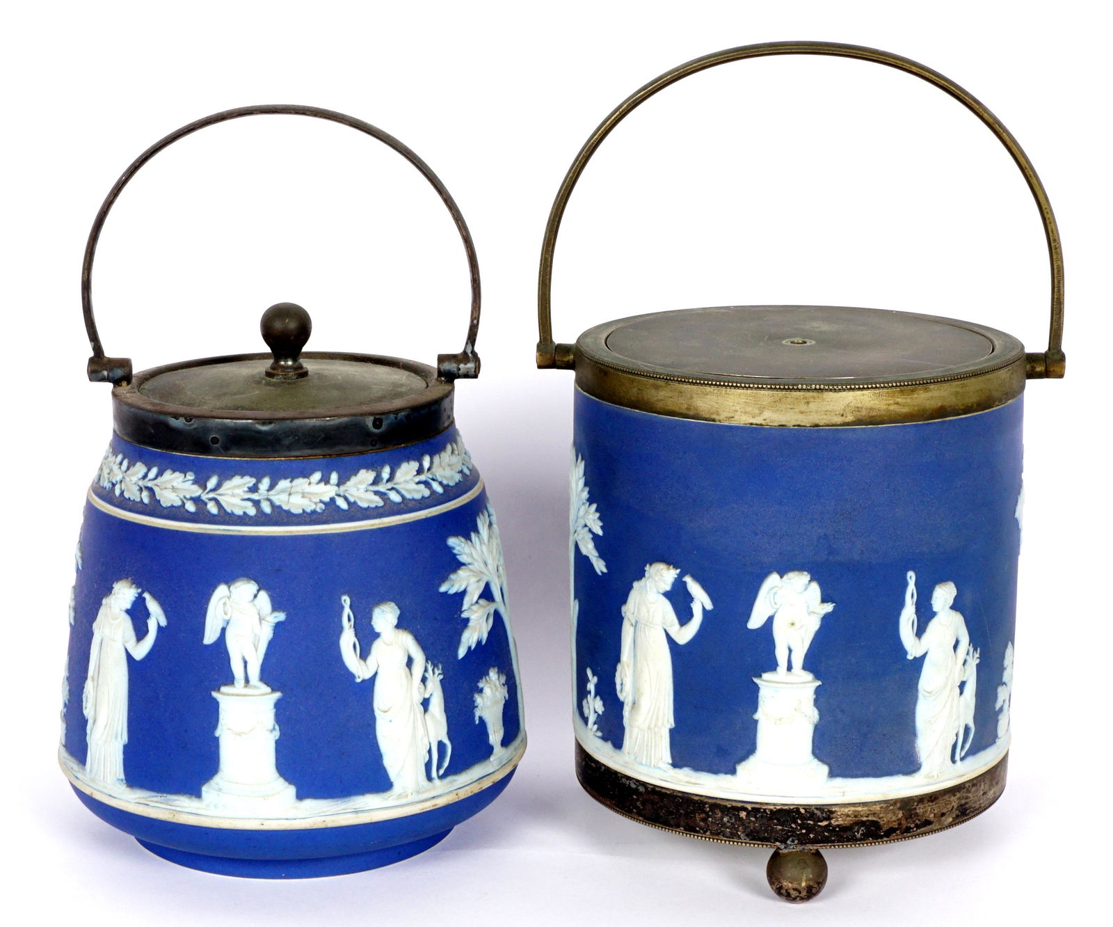 Two Wedgwood Jasperware Biscuit Jars: Two pieces total to include 1) Round dark blue, white decorated neoclassical design, silverplate mounts with handle, on three ball feet, 6"h. x 5.25". Lid missing finial. 2) Tapered round dark blue, w