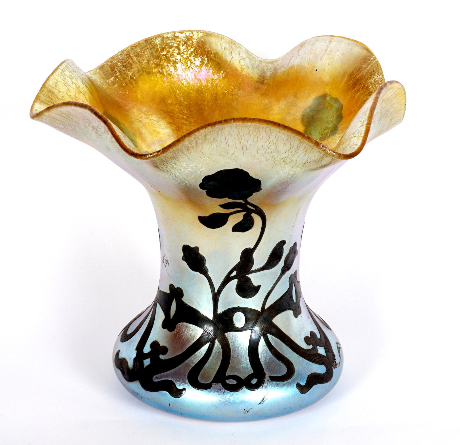 Quezal Silver Overlay Vase: Iridescent gold vase, ruffled rim, floral motif silver overlay extending from base, signed on pontil Quezal and D 1446. Overall 6.5" h. x 7.25". Condition: Several spots of overlay loss.