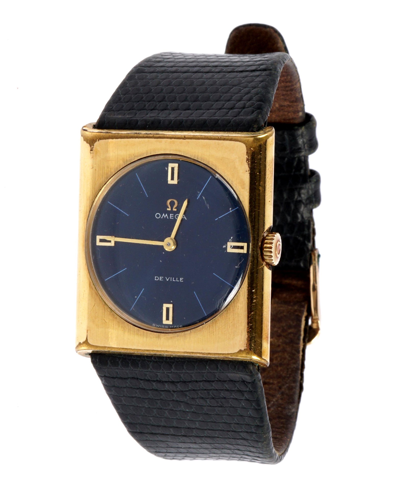 Vintage Omega De Ville Blue Dial Goldtone Watch: Square gold tone and stainless steel case, round blue dial marked Omega and De Ville, manual wind, 1 1/8" x 1". Alligator leather band, 8" long. Condition: Scratches and signs of wear.