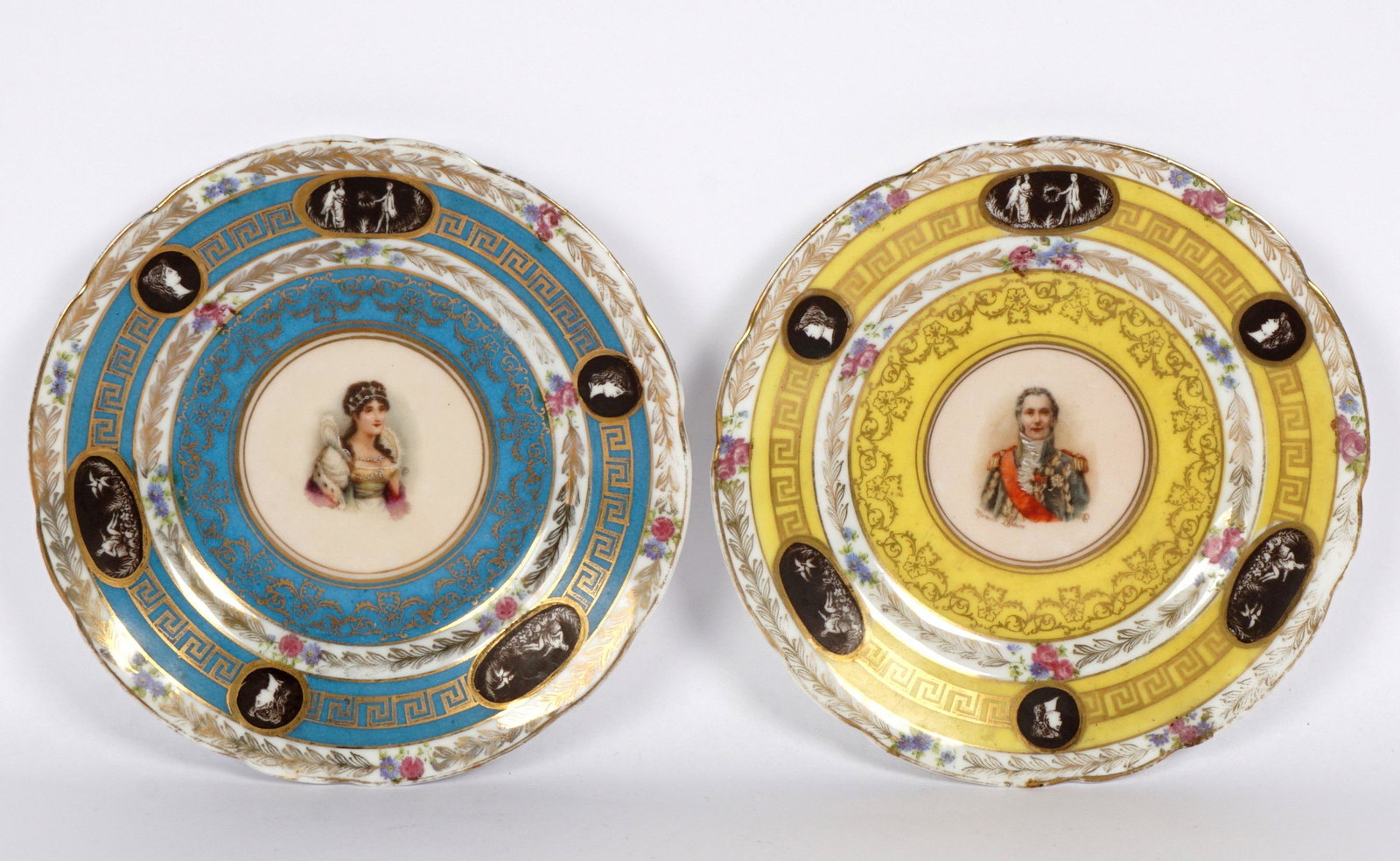 Pair Diminutive French Portrait Plates: One with yellow ground, portrait of man center, fluted rim, neoclassical vignettes in reserves, the other with blue ground, woman in center, matching decoration. Each marked with red crown over N, num