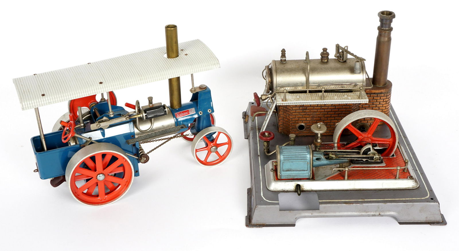 Wilesco Steam Engine & Old Smokey Traction Engine: Two pieces total to include 1) Wilesco steam engine on metal base, 9.5" h. x 13.75" x 11.5". 2) "Old Smokey" traction engine, 9.75" h. x 12.5" x 6". We are not experts on steam engines and cannot guar