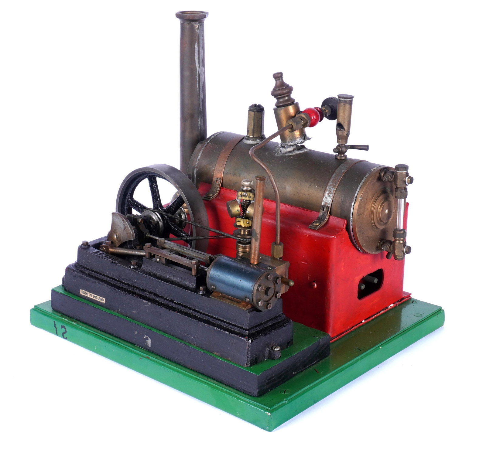Vintage English Stuart Steam Engine: Electric horizontal boiler Stuart steam engine, on metal base overall 9.75" h. x 10.25" x 9". Damage to valve on boiler. We are not experts on steam engines and cannot guarantee completeness or functi