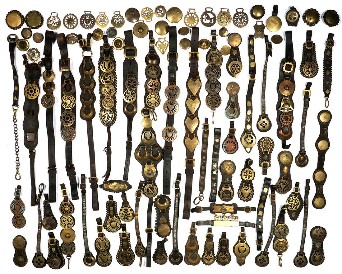 Large Collection of Brass Horse Bridle Medallions: Approx. 200 antique brass horse bridle medallion badges, many still attached to leather straps, condition varies.