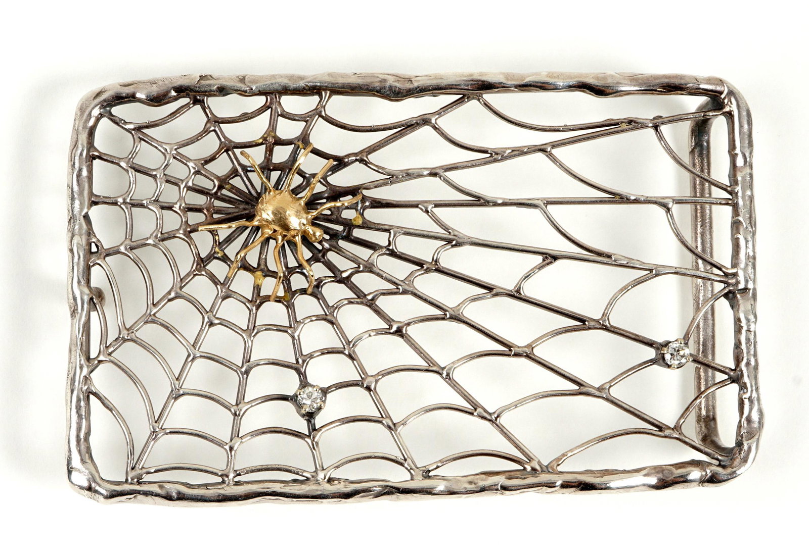 Sterling Gold and Diamond Spiderweb Belt Buckle: Sterling Silver spiderweb design belt buckle, spider tests as 14k, one .1ct diamond, the other tests as moissanite, unmarked, 3.75" x 2.5". Approx. 42 grams.