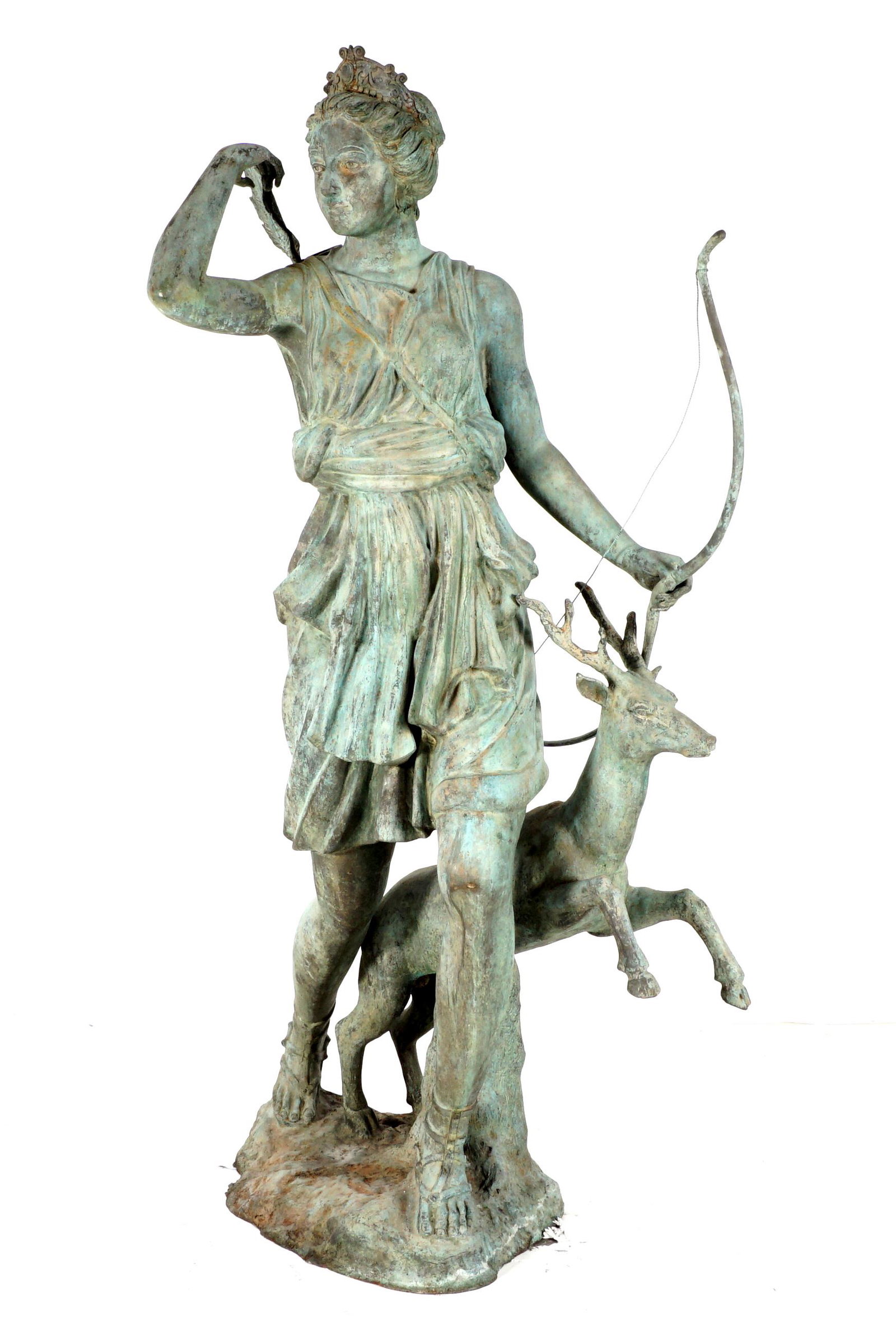 Life Size Diana the Huntress Bronze Sculpture: Life size bronze figural group of Diana the Huntress with bow, quiver, and a leaping deer at her feet. Overall 82" h. x 48" x 34". Condition: Obvious signs of weathering, verdigris.