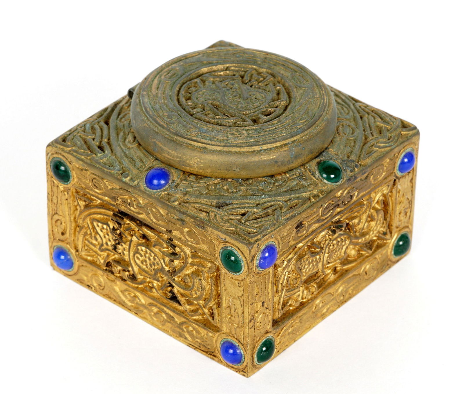 Tiffany Studios Gilt Bronze 9th Century Inkwell: Gilt bronze inkwell in the Ninth Century pattern by Tiffany Studios, accented with glass jewels, well marked Tiffany Studios, New York, 1699, glass insert. 2" x 2.75" x 2.75". Condition: Uneven finish