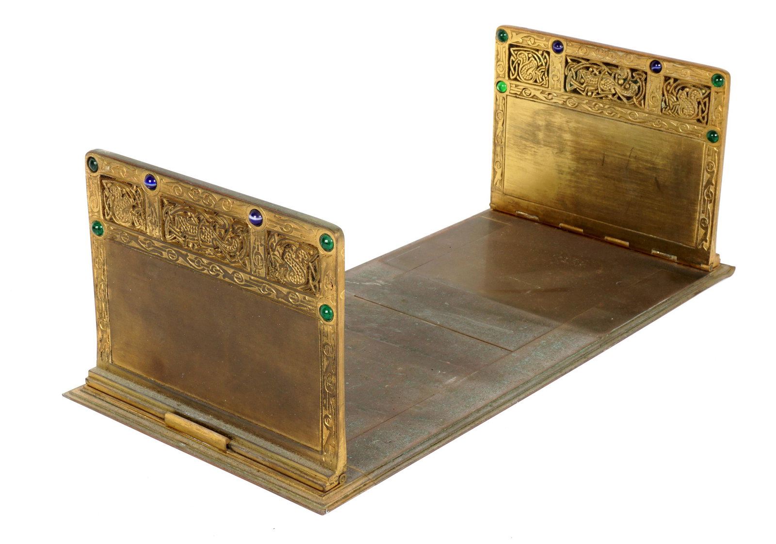 Tiffany Studios 9th Century Adjustable Bookends: Gilt bronze adjustable in the Ninth Century pattern by Tiffany Studios, accented with glass jewels, well marked Tiffany Studios, New York. 5" h. x 6.5" x 14.5" closed, 24" long open. Condition: Bend t