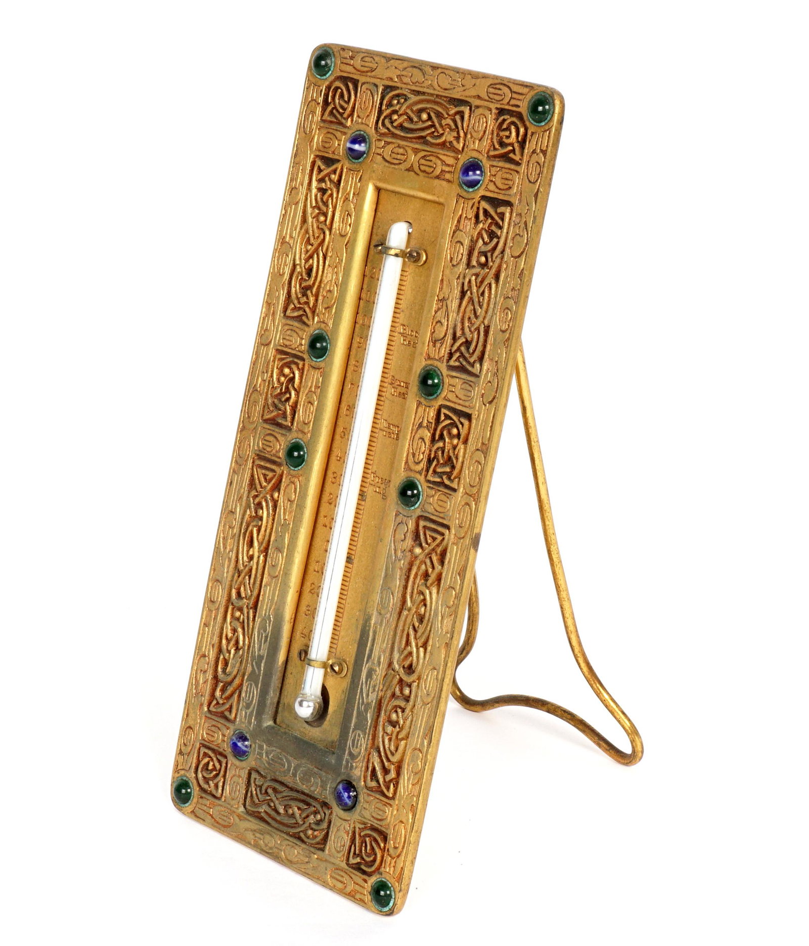 Tiffany Studios Bronze 9th Century Thermometer: Gilt bronze thermometer in the Ninth Century pattern by Tiffany Studios, accented with glass jewels, easel back, well marked Tiffany Studios, New York, 1247, 8.25" x 3.5". Condition: Uneven finish, ve