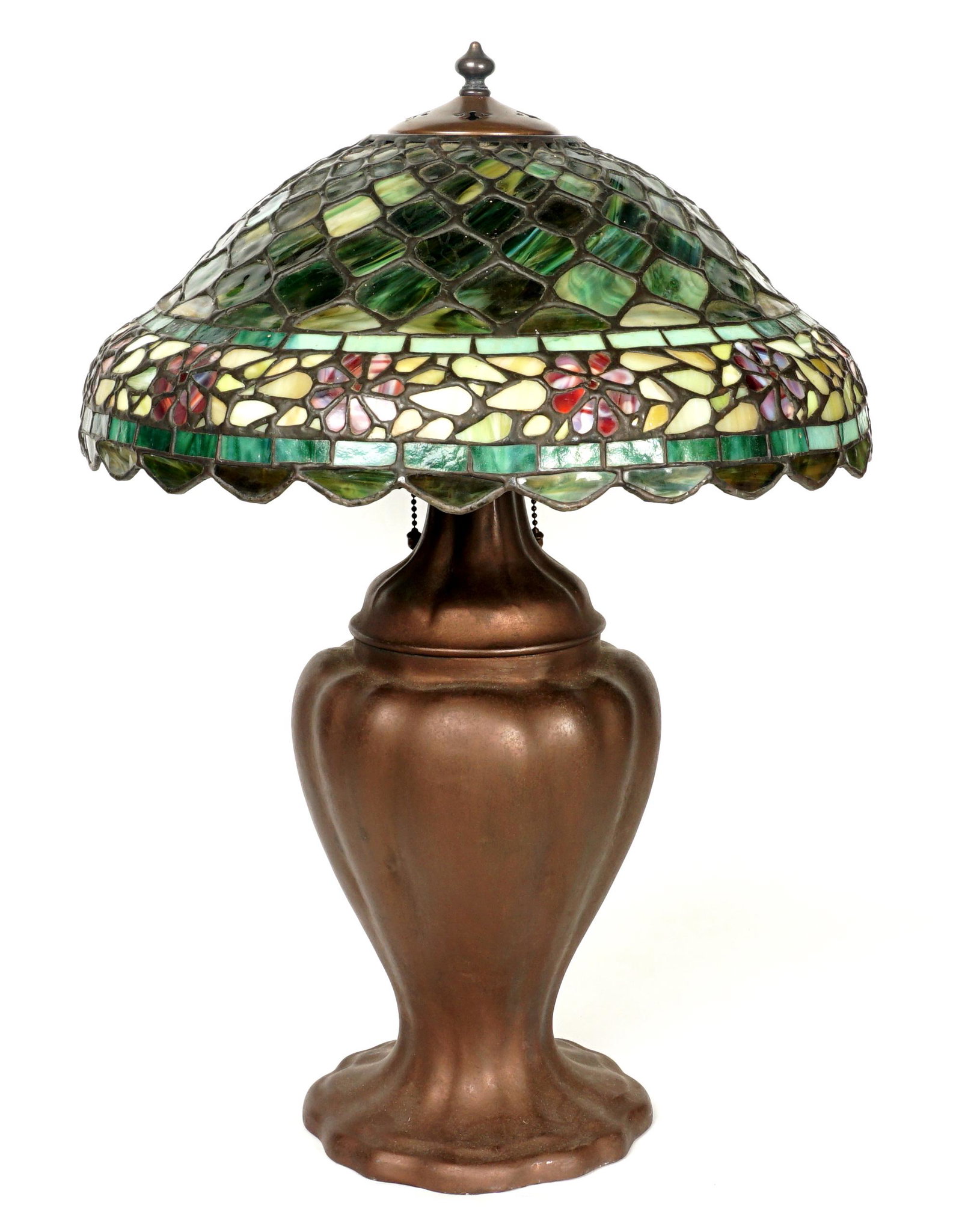 Handel Patinated Bronze Lamp Leaded Glass Shade: Ribbed baluster form base, triple socket fixture with original acorn pulls, 24" h. x 8" dia. Sold with a nice unsigned leaded glass shade 6.5" h. x 17", 3.5" aperture. Condition: One panel with crack