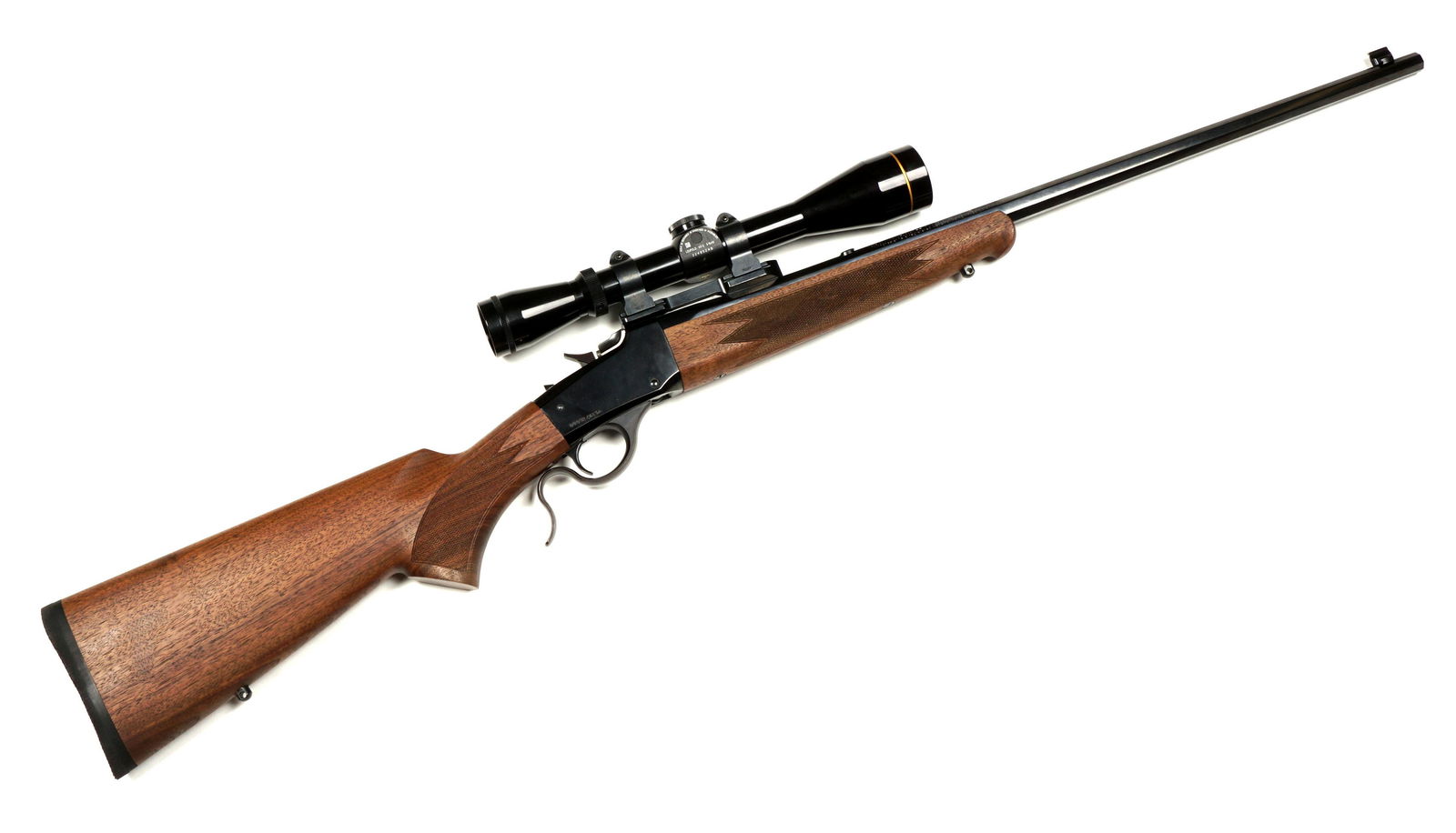 Winchester Miroku Model 1885 Rifle with Scope: Model 1855 High Wall, .17 HMR caliber 24" blued octagon barrel, checkered walnut stock, Leupold VX-2 3- 9 x 40mm scope, serial number 0002ZW85A. Overall 40" long, length of pull 13.5". Condition: Clea