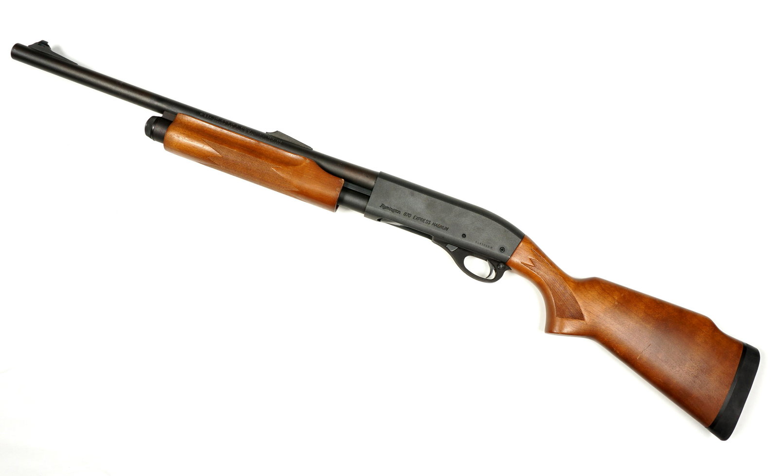 Remington 870 Express Magnum 12 Gauge Shotgun: 12 gauge pump action shotgun, 20" blued barrel, wood stock, overall 40.5" long, length of pull 14". Serial number BM43669M. Condition: Clean bore, minor scratches to stock and barrel. Ships to FFL, no