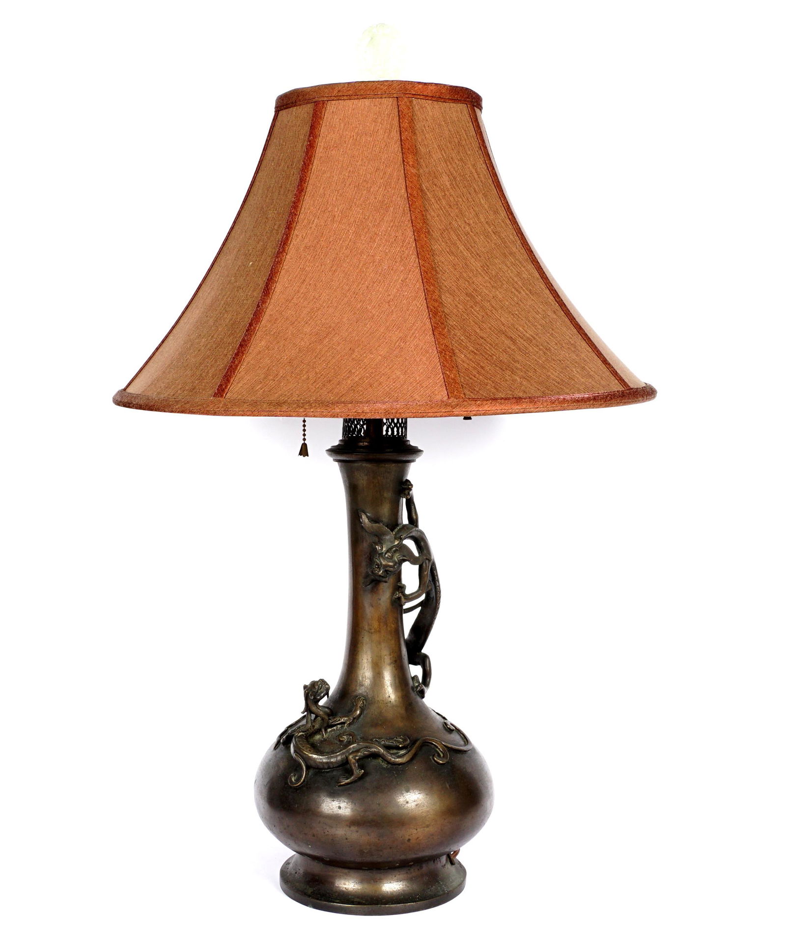 Chinese Bronze Dragon Lamp: Bottle form bronze base with applied figural Qilin or dragons, open bottom, triple socket fixture, pierced jade finial, overall 30.75" h. x 8.5". Sold with cloth shade.