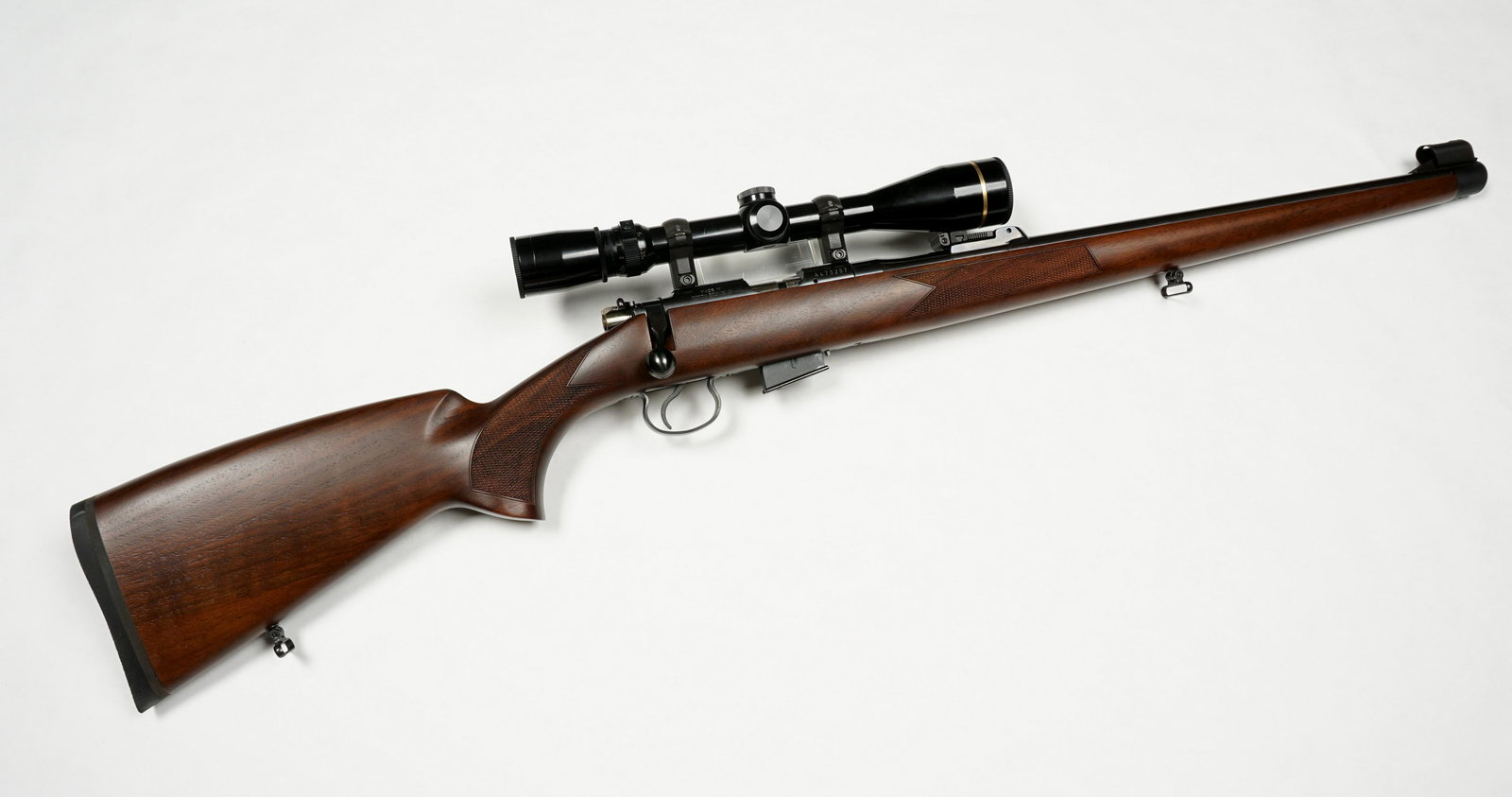 CZ 452 - 2E ZKM American Bolt Action Rifle: CZ 452 - 2E ZKM American, .17 HMR caliber approx. 20.75" barrel, checkered wood stock, serial number A473257, Leupold VX-III 3.5 - 10" x 40mm. Overall 39" long, length of pull 14". Condition: Minor si