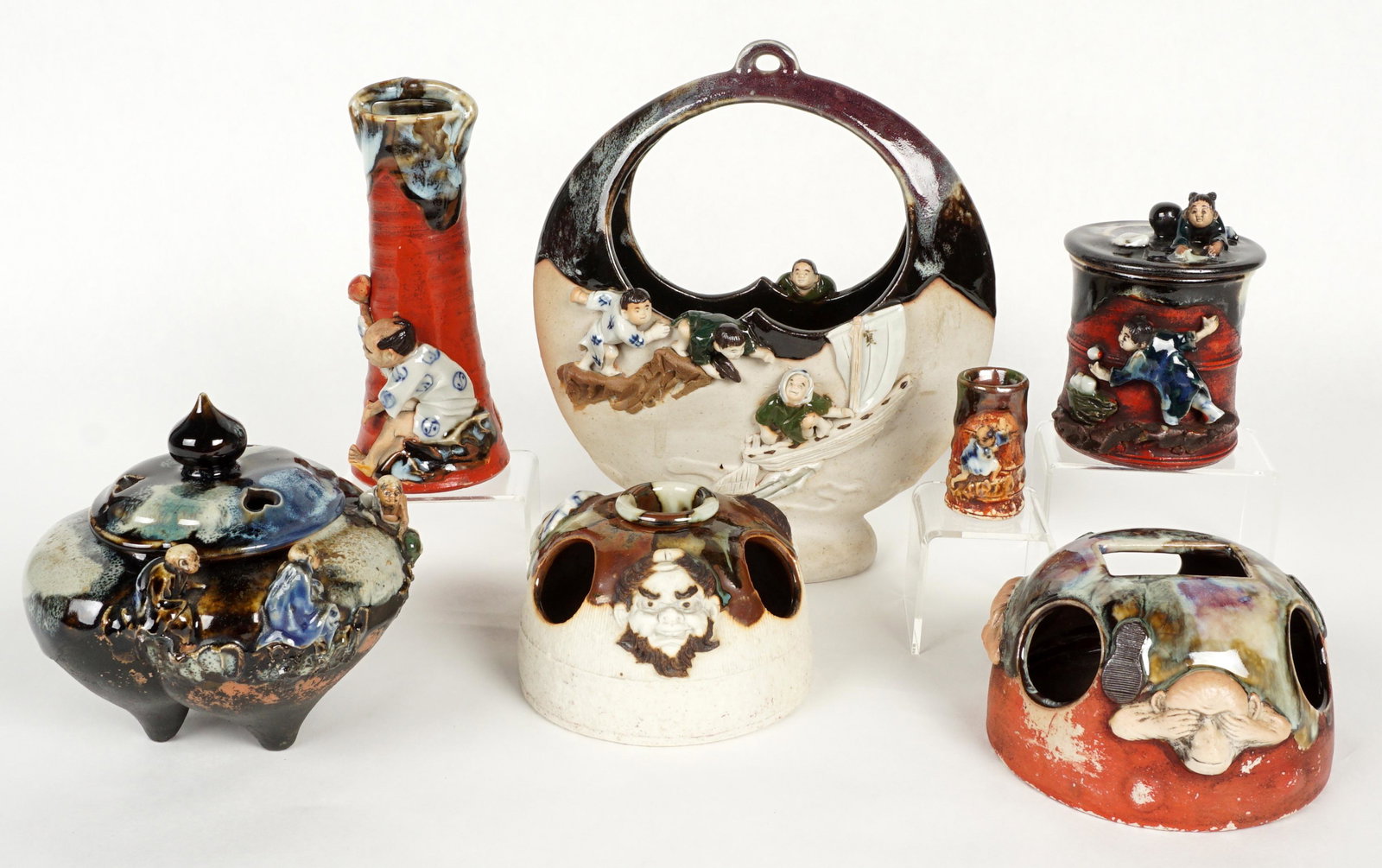 Seven Piece Japanese Sumida Gawa Items: Seven pieces total to include 1) Figural moon vase, stamped on base, 8.75" h. x 7.75" x 3.25". 2) Tripod censer, signed on plaque, 5" h. x 5.5". 3) Covered jar, signed on plaque, 4.5" h. x 3.25". 4) H