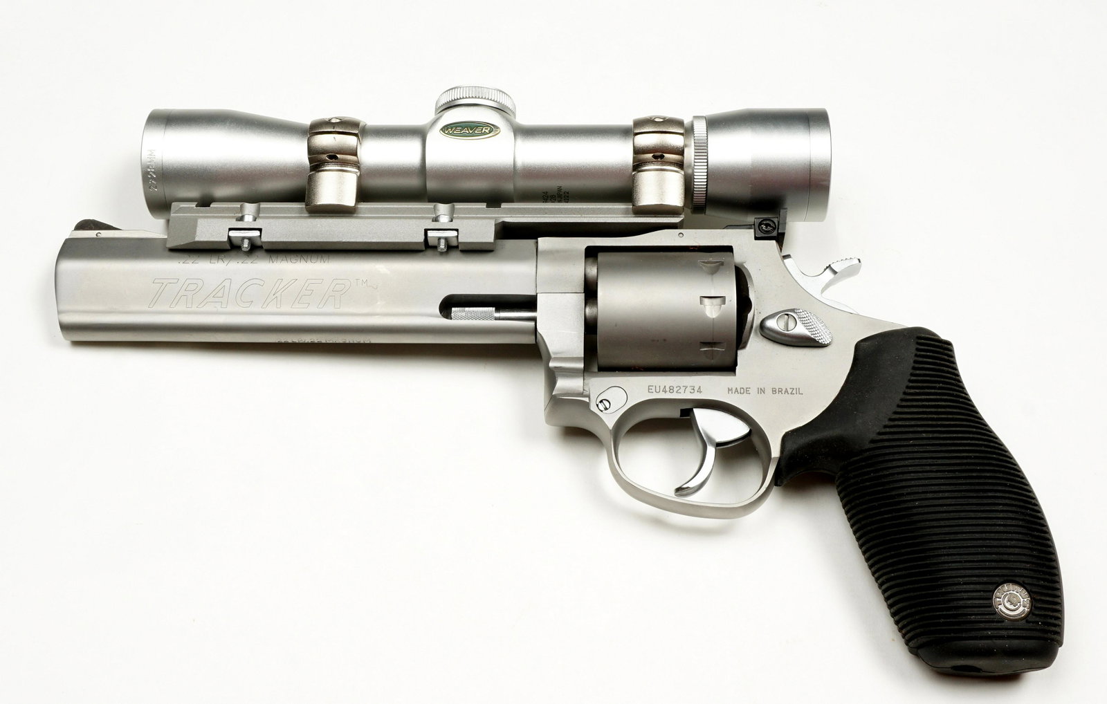 Taurus Tracker Model 992 .22 Stainless Revolver: Taurus Tracker model 992, 22 long and magnum caliber 6.5" stainless barrel, 9 shot cylinder, rubber grips, Weaver Classic 2 x 28mm scope. Overall 11.5". Condition: Overall excellent, minor scratches,