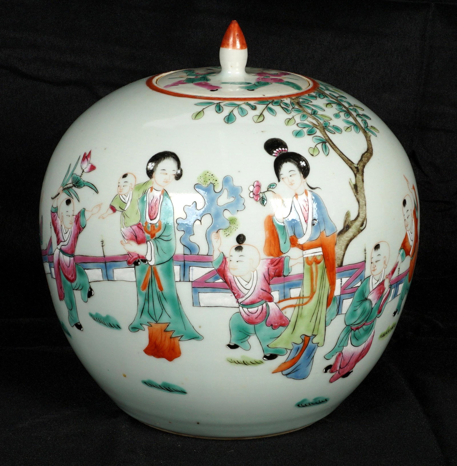 Chinese Polychrome Decorated Ginger Jar: Ovoid form ginger jar decorated with outdoor courtyard scene with children playing, unmarked, overall 9" h. x 8.5". Condition: Interior rim chips.