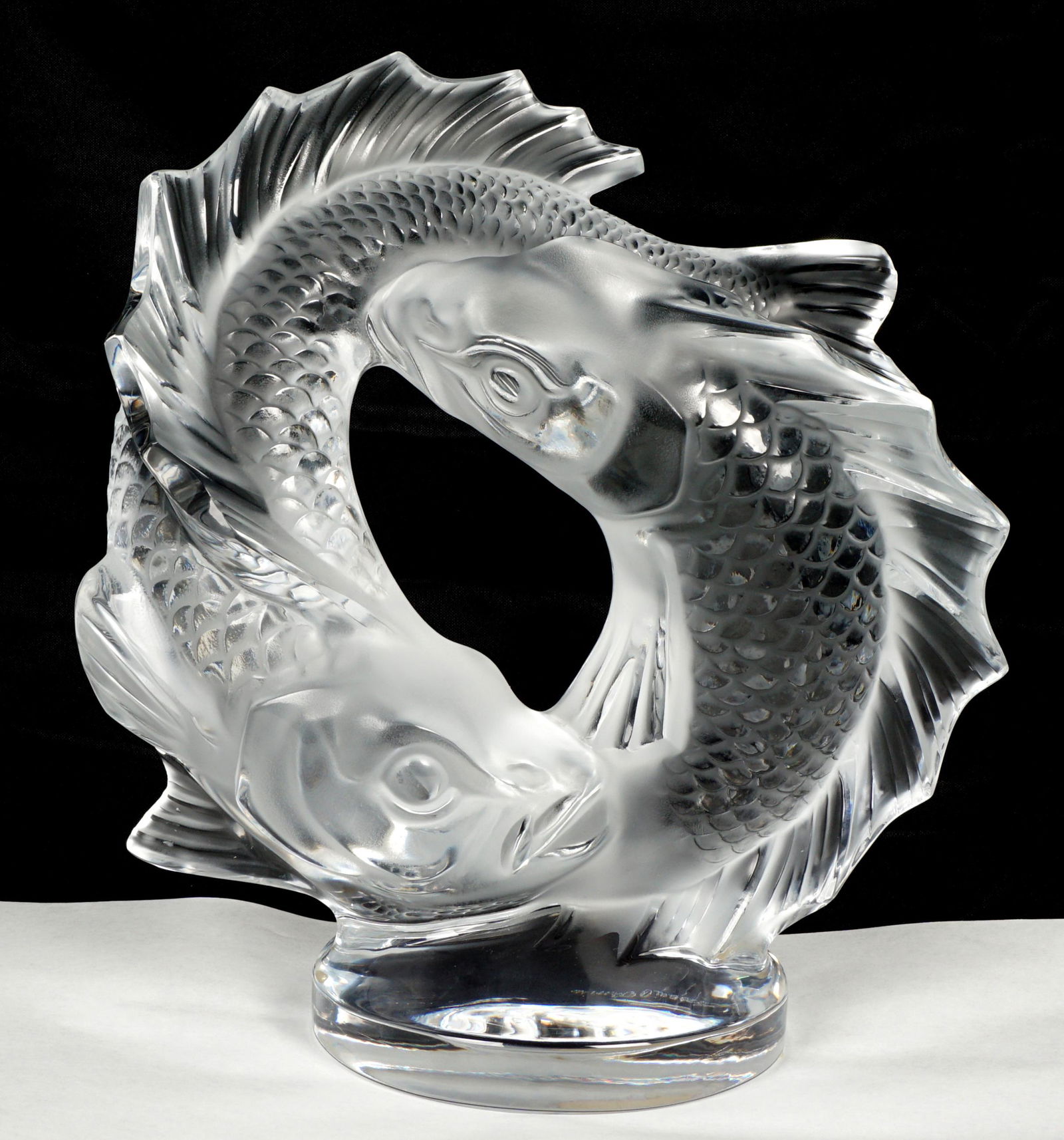 Lalique Deux Poissons Pisces Crystal Fish: Clear and frosted molded crystal fish figural group titled "Deux Poissons", etched signed, 11.25" h. x 1.25" x 5.75".