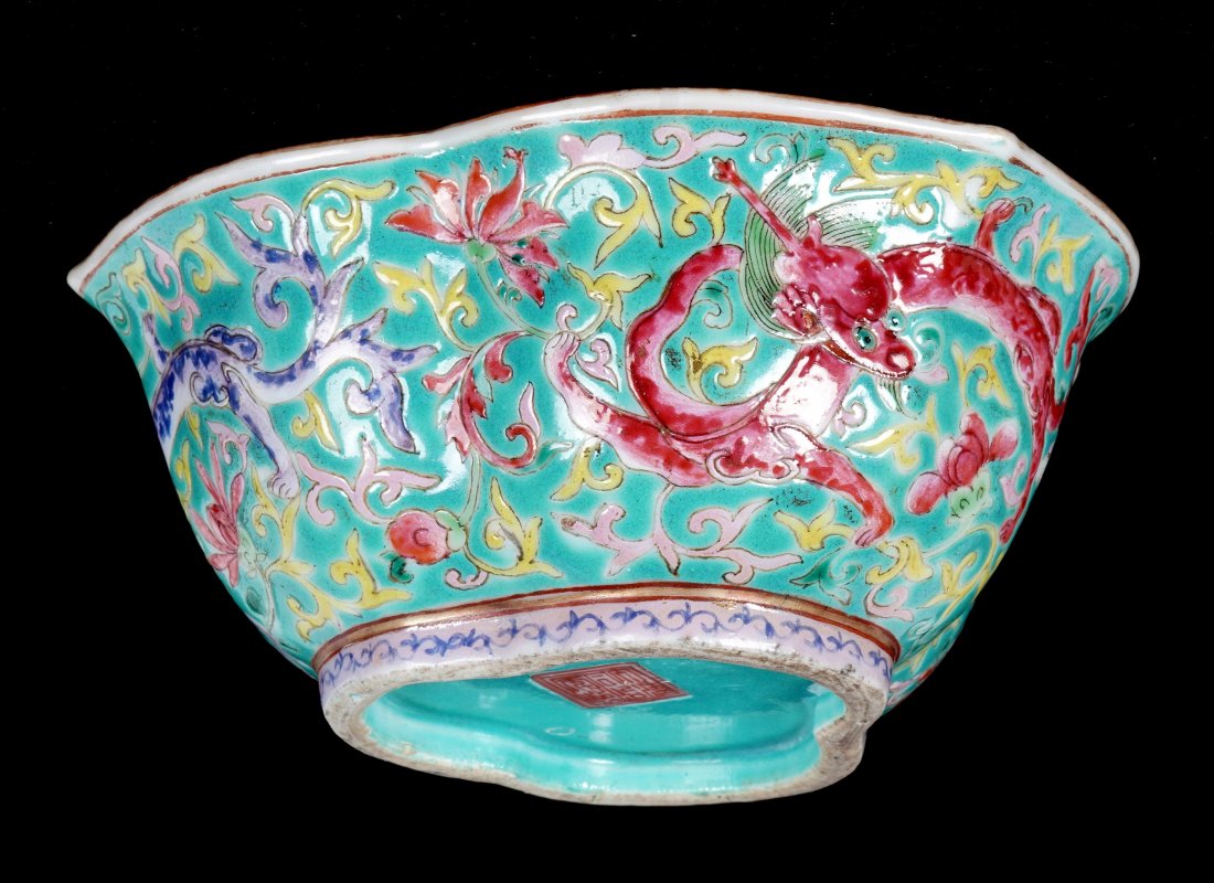 Chinese Qing Famille Rose Porcelain Dragon Bowl: Most likely 19th century small bowl with lotus scalloped rim, green enamel ground, polychrome dragon, fruit and foliate motifs, green interior, footed base, bearing a Tongzhi mark, overall 2.5" h .x 5