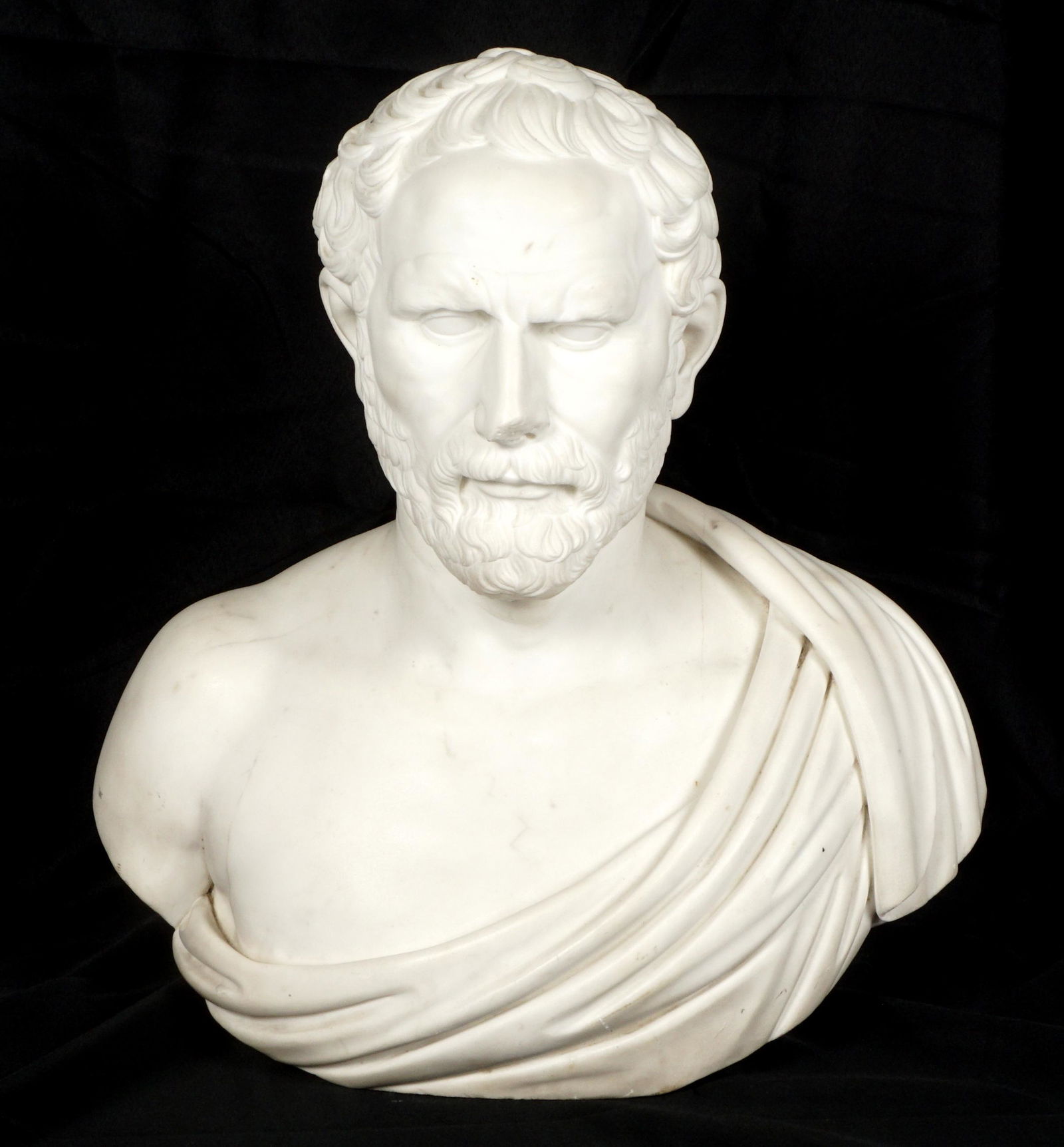 19th / 20th C. Carved Marble Bust of a Philosopher: Neoclassical carved white marble bust of a philosopher or teacher, no visible signature, overall 21.25" x 21.25" x 12". Condition: Repair to robe on back, loss to nose.