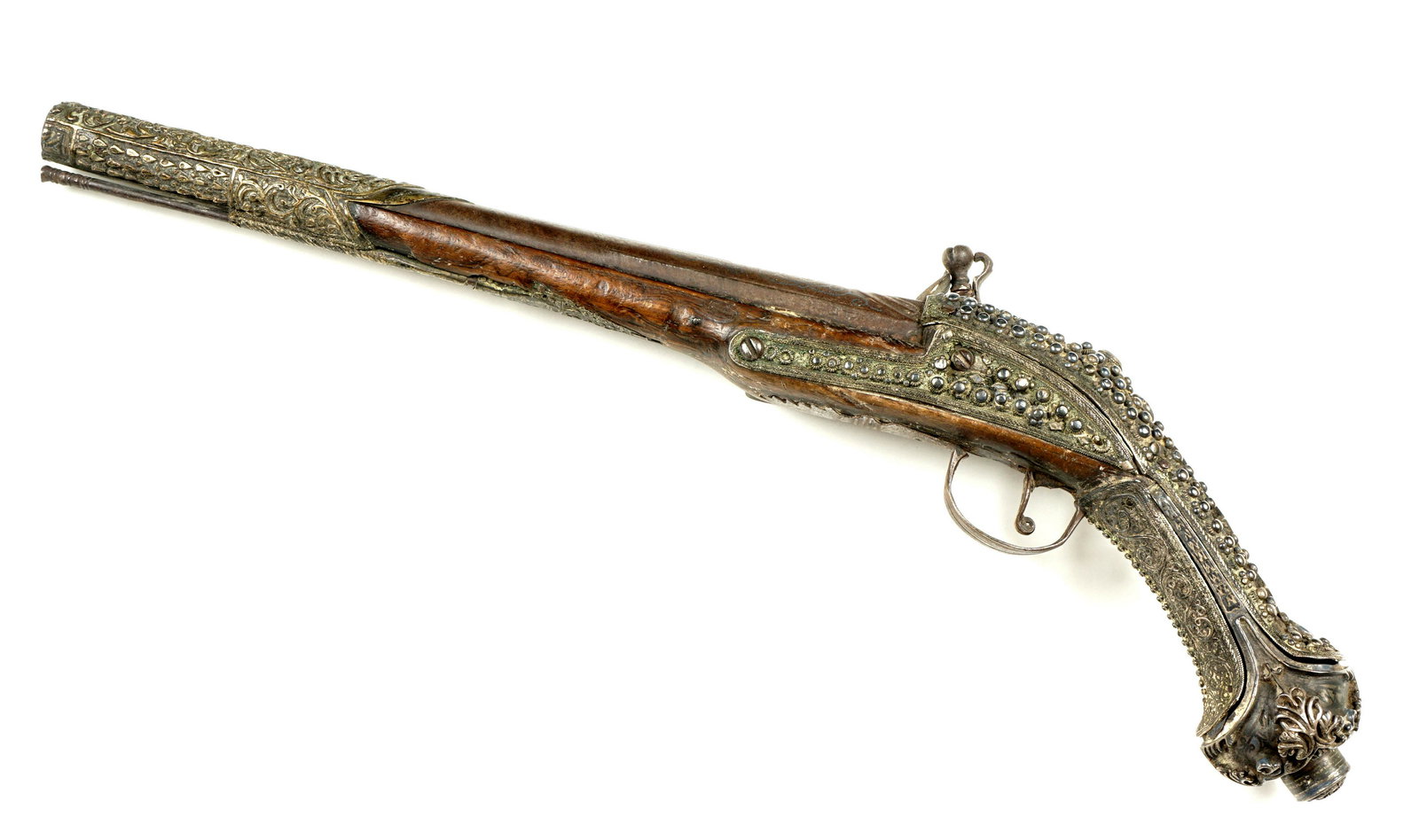 Ornate 18th C. Ottoman Flintlock Kubur Pistol: Silver scroll niello inlaid 12.75" barrel, approx .62 caliber, wood stock, silvered fitting with raised beads, coral cabochons, and inset diamond shaped inlays. silvered brass repousse forestock. Miqu
