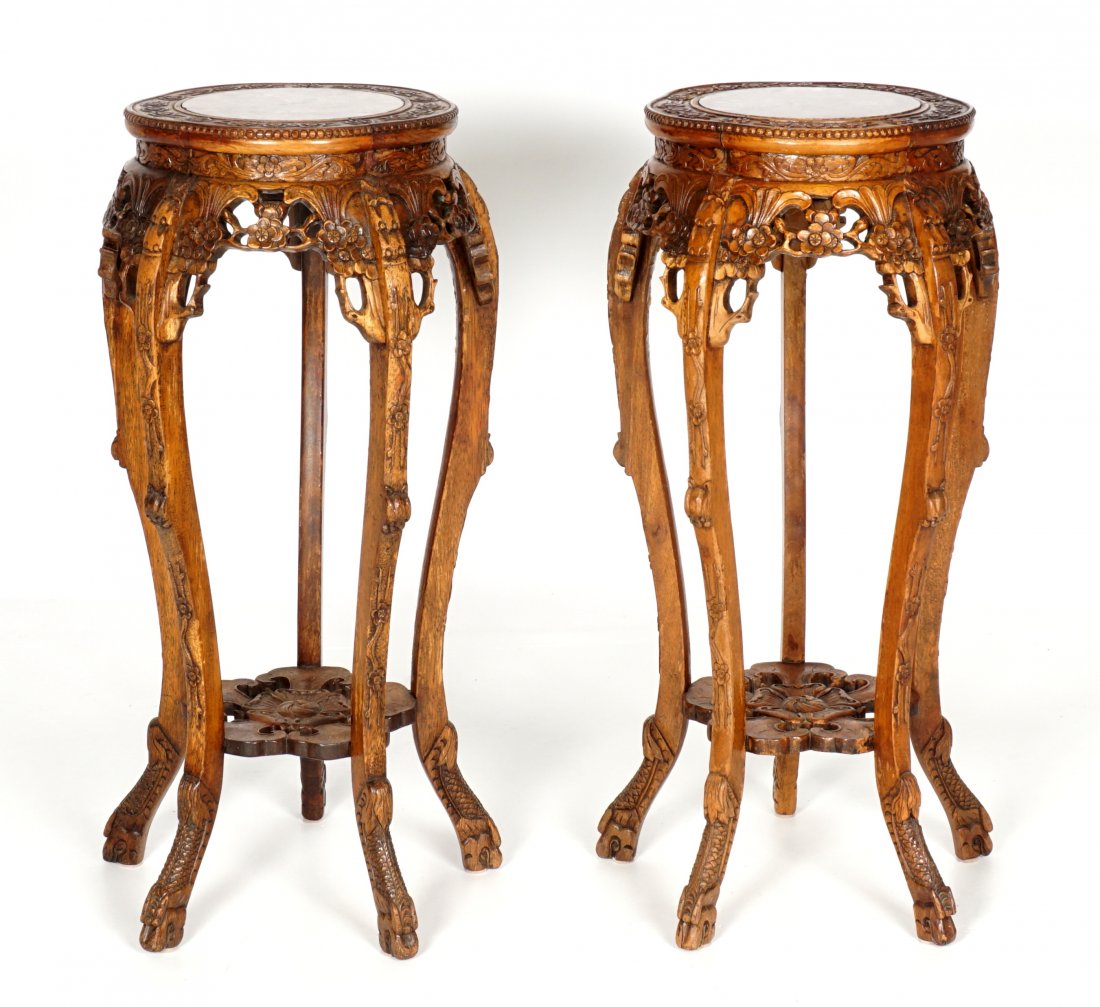Pair Ornate Chinese Inset Marble Plant Stands: Matched pair shaped round marble inset tops, pierced carved shaped foliate motif skirt, carved legs, floriform lower stretcher, overall 36" h. x 17". Condition: Scratches to marble.