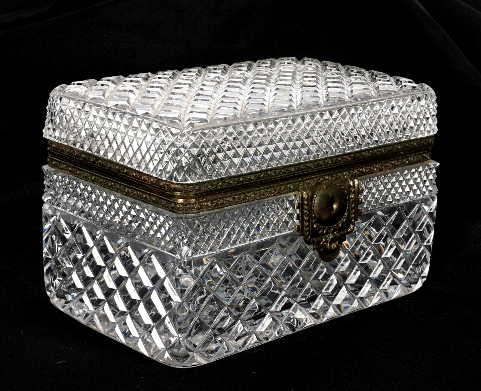 Large Crystal Jewelry Casket / Box: Cut crystal body, embossed metal decoration, no visible marks. 5" h. x 8.25" x 5". Condition: Wear to decoration, hinge broken, the occasional chip may be discovered