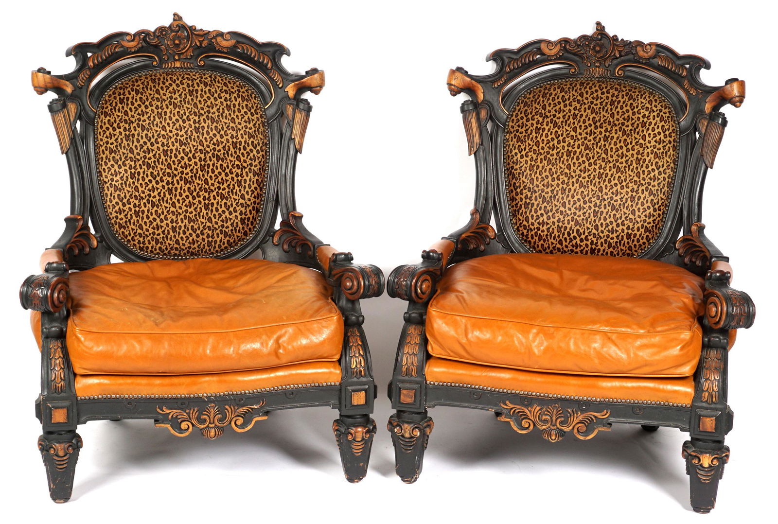 Pair Oversized Old Hickory Tannery Chairs: Molded frames, foliate scroll top rail, shaped arms, supports, and skirt. Leopard print back, brown leather cushion and arm rests. Overall approx. 48.5" h. x 39" x 39". Condition: Signs of wear and us