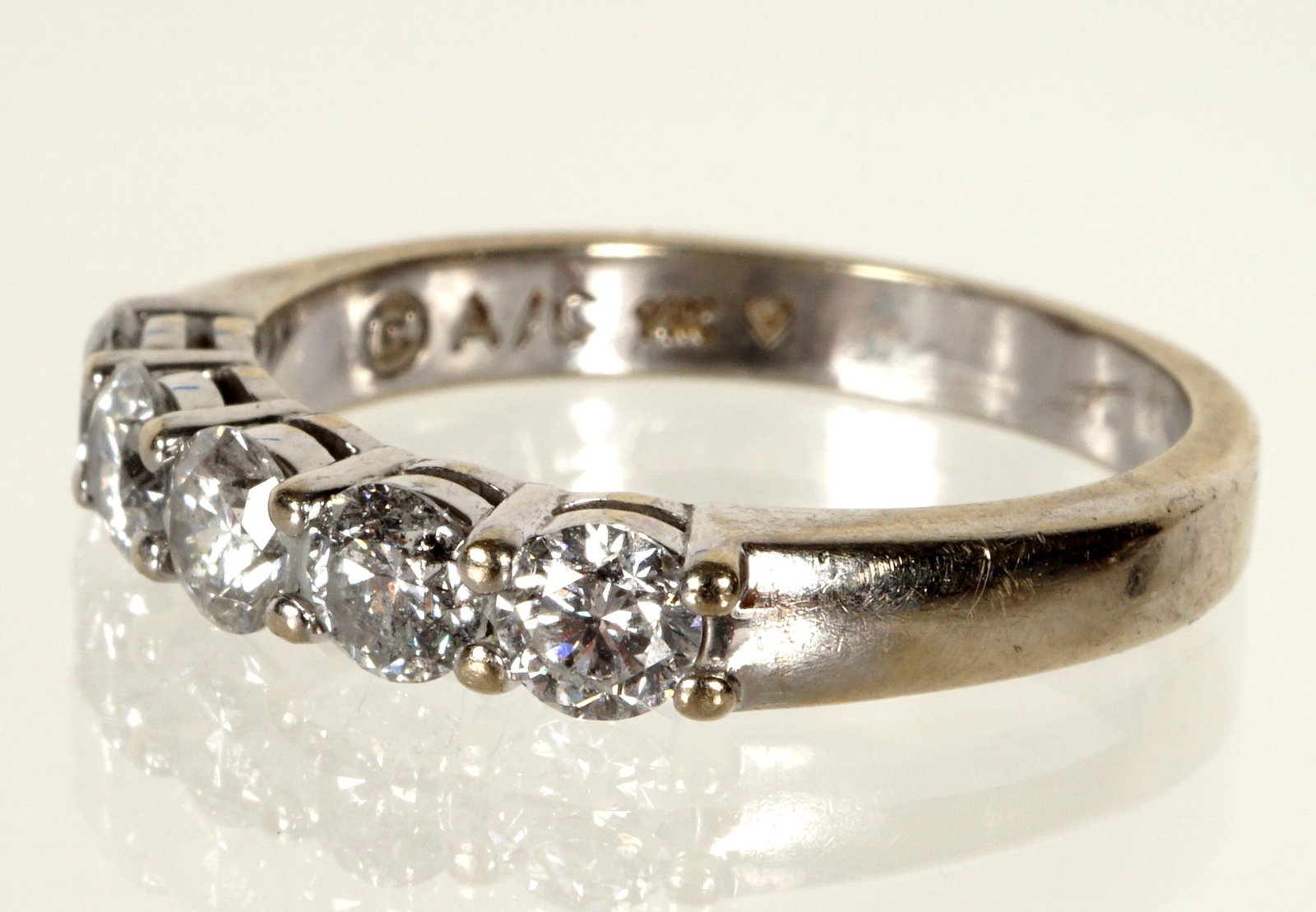14k White Gold & Diamond Eternity Ring: 14k white gold, 4 prong set diamond, approx. 1 ctw. size 7.5, approx. 3.8 grams.