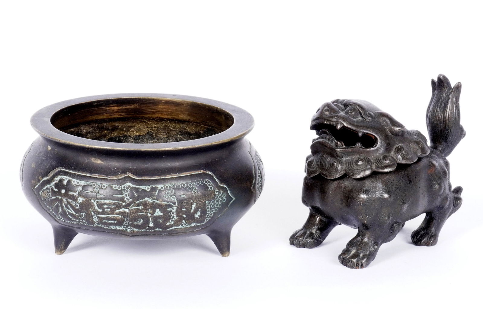 Chinese Bronze Censer and Foo Dog: Two Chinese bronze censers to include 1) Tri footed round censer, three panels of characters on sides, 15 character Ming mark on base, 2.5" x 5". 2) Foo Dog with removable head, impressed AN 19 on bas