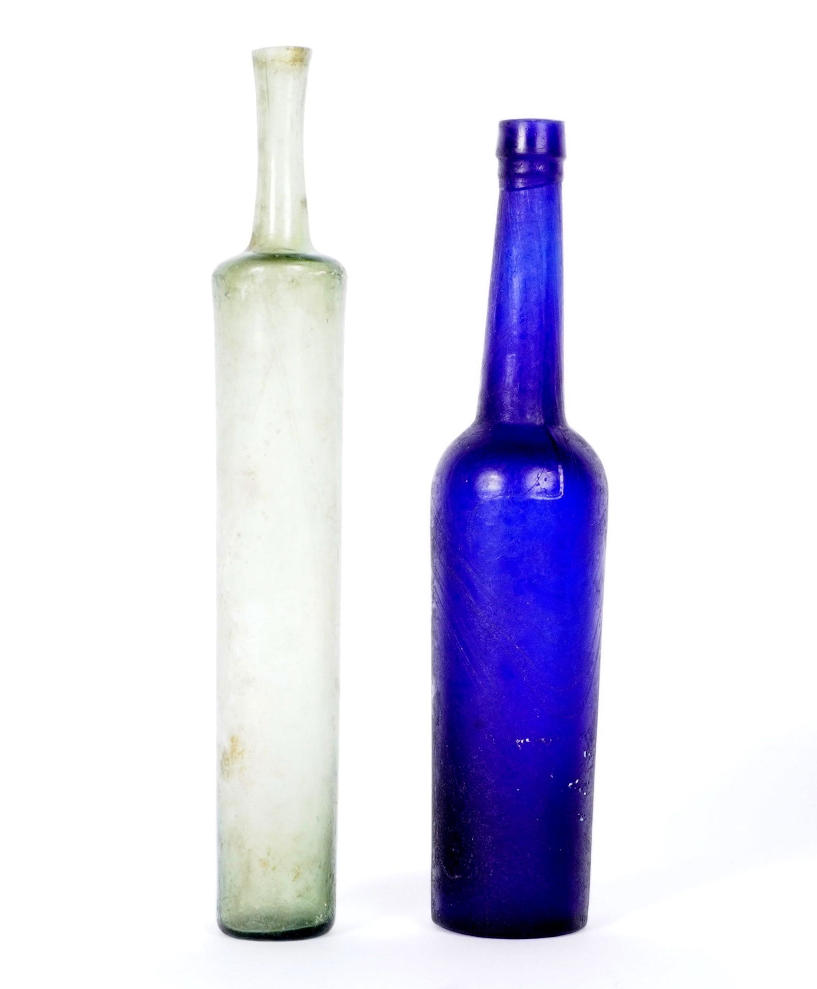 Two Hand Blown Tall Cologne Bottles: Two pieces total to include 1) Cobalt blue with swirls, 8.5". 2) Clear green, 9.25".