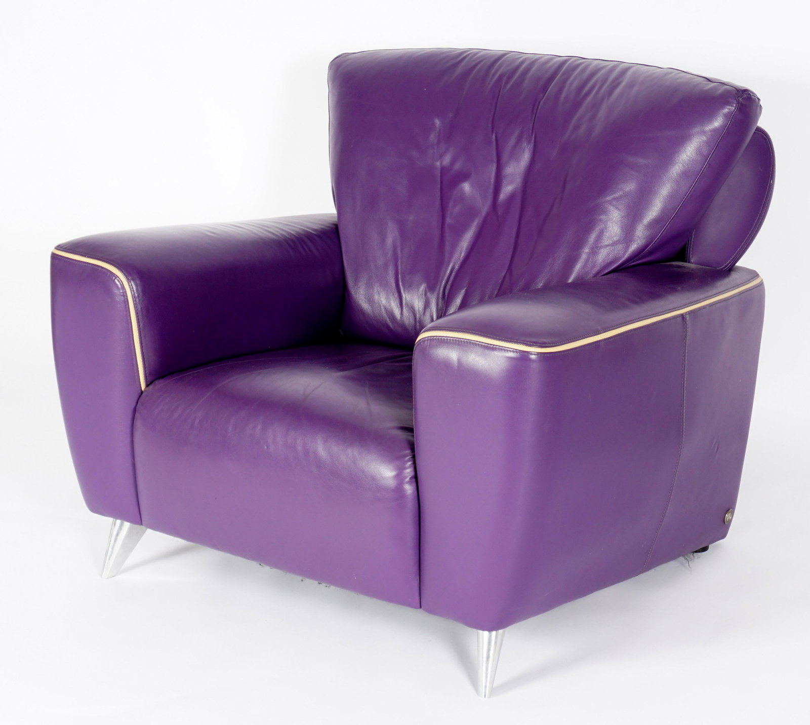 American Leather Purple Club Chair: Oversized purple leather club chair with ivory piping, brushed steel legs, American Leather tag underside, overall 33.25" h. x 41.5" x 42". Condition: Minor signs of use.