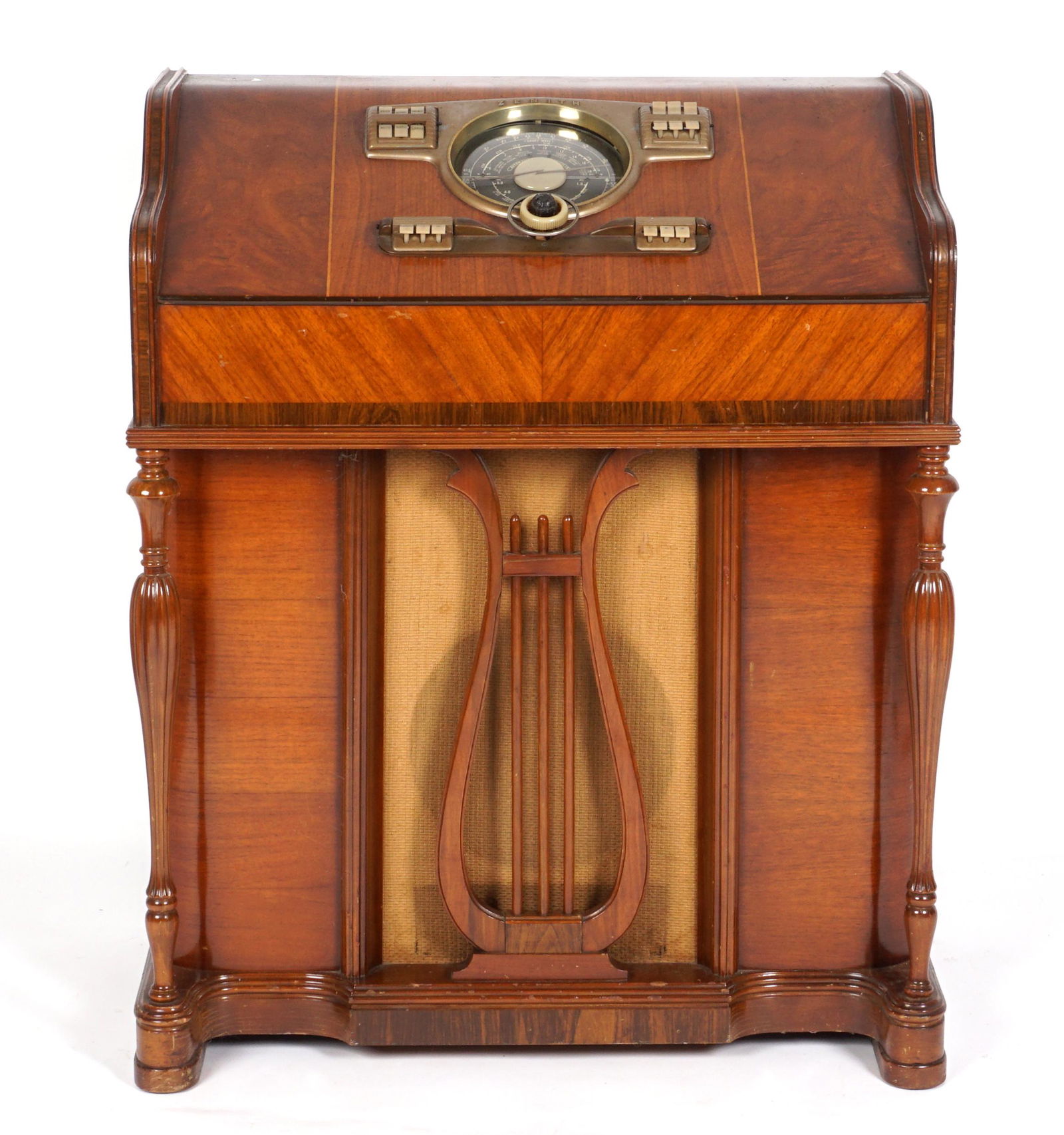 Zenith Spinet Floor Radio Model 10-H-571: Wood "Spinet" case with string inlay, carved and turned columns, lyre front decoration. Chassis 1OA3, push button and dial console, overall 38.25" h. x 31.25" x 17". Condition: Currently not working,
