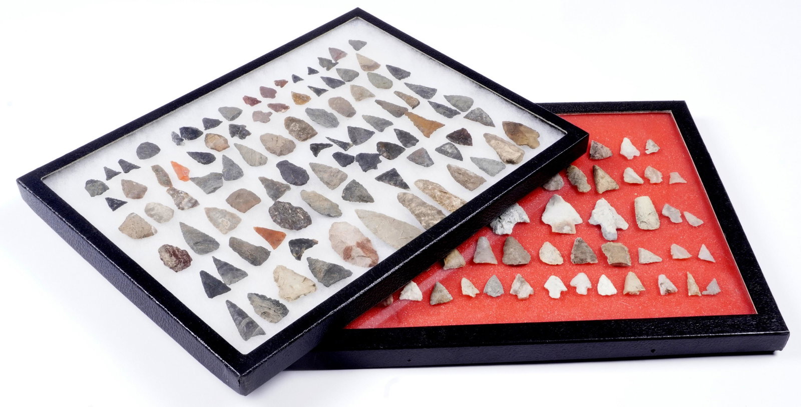 Collection of Woodland and Triangle Points: An assembled collection of approx. 163 points, varying size and construction, sold with 2 Riker mounts, 16.25" x 12.25".